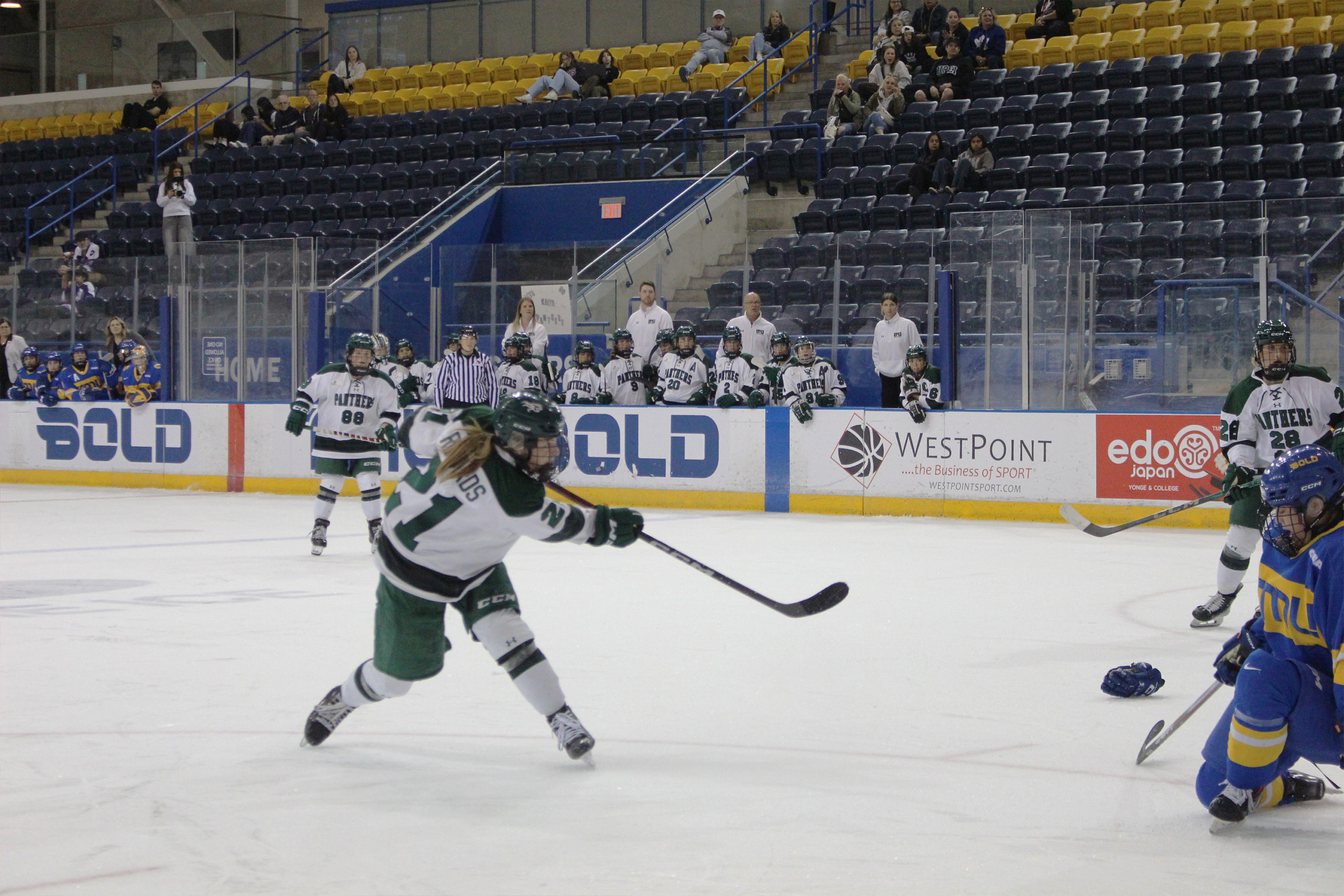 A UPEI player shoots the puck