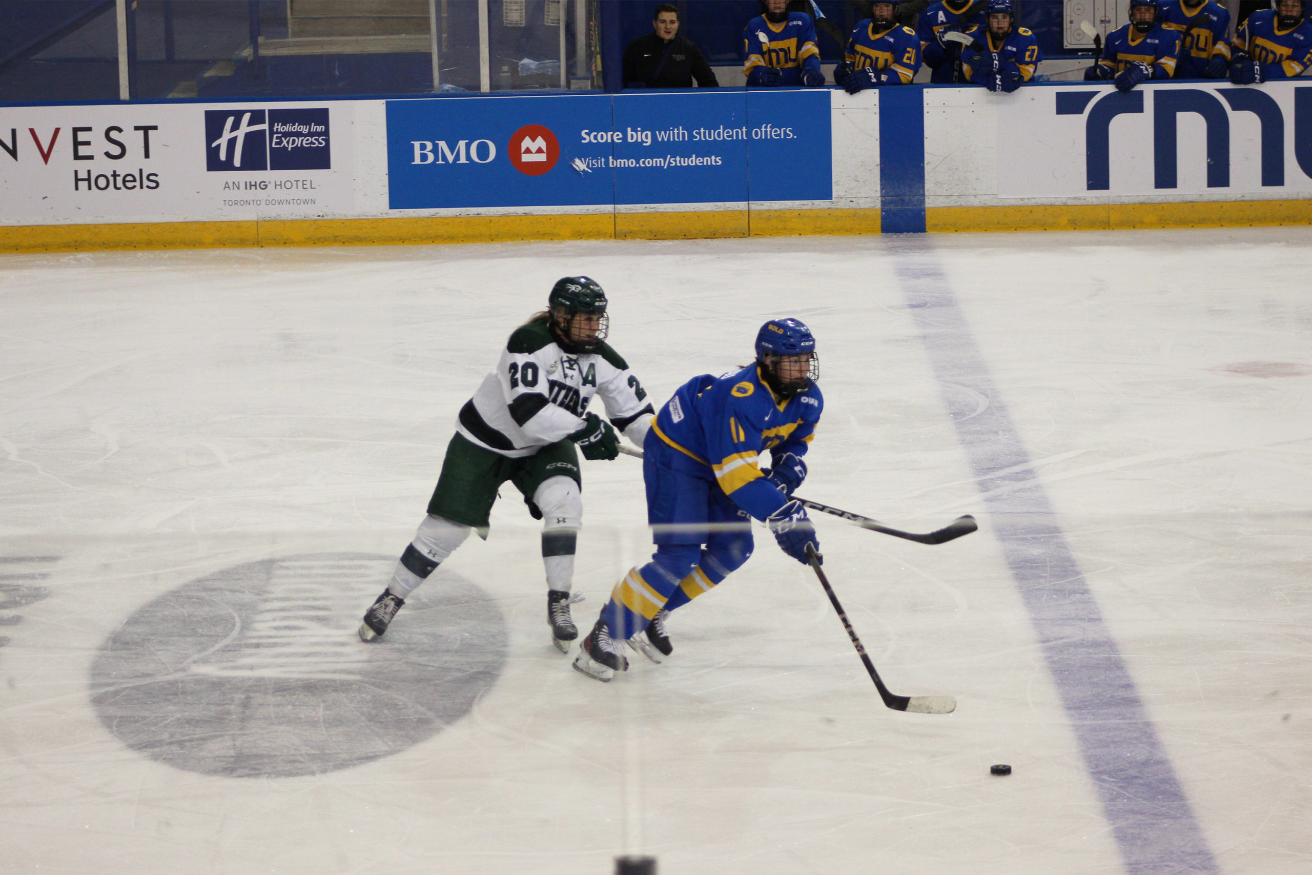 A TMU and UPEI race to the puck