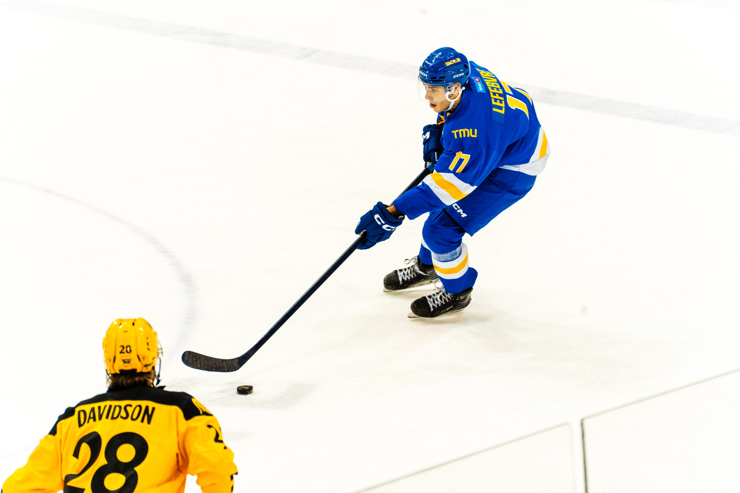 Chase Lefebvre skates with the puck