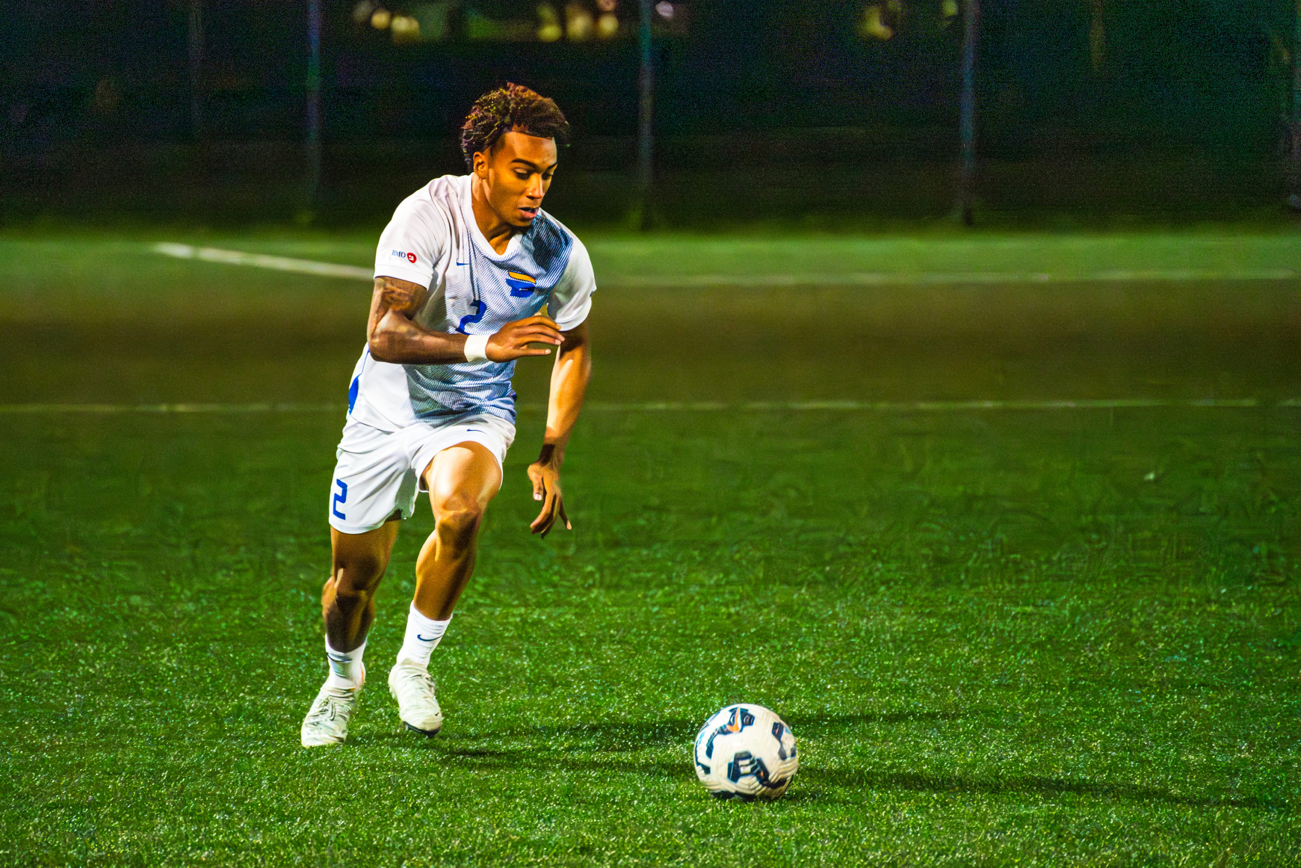 A TMU player prepares to kick the ball