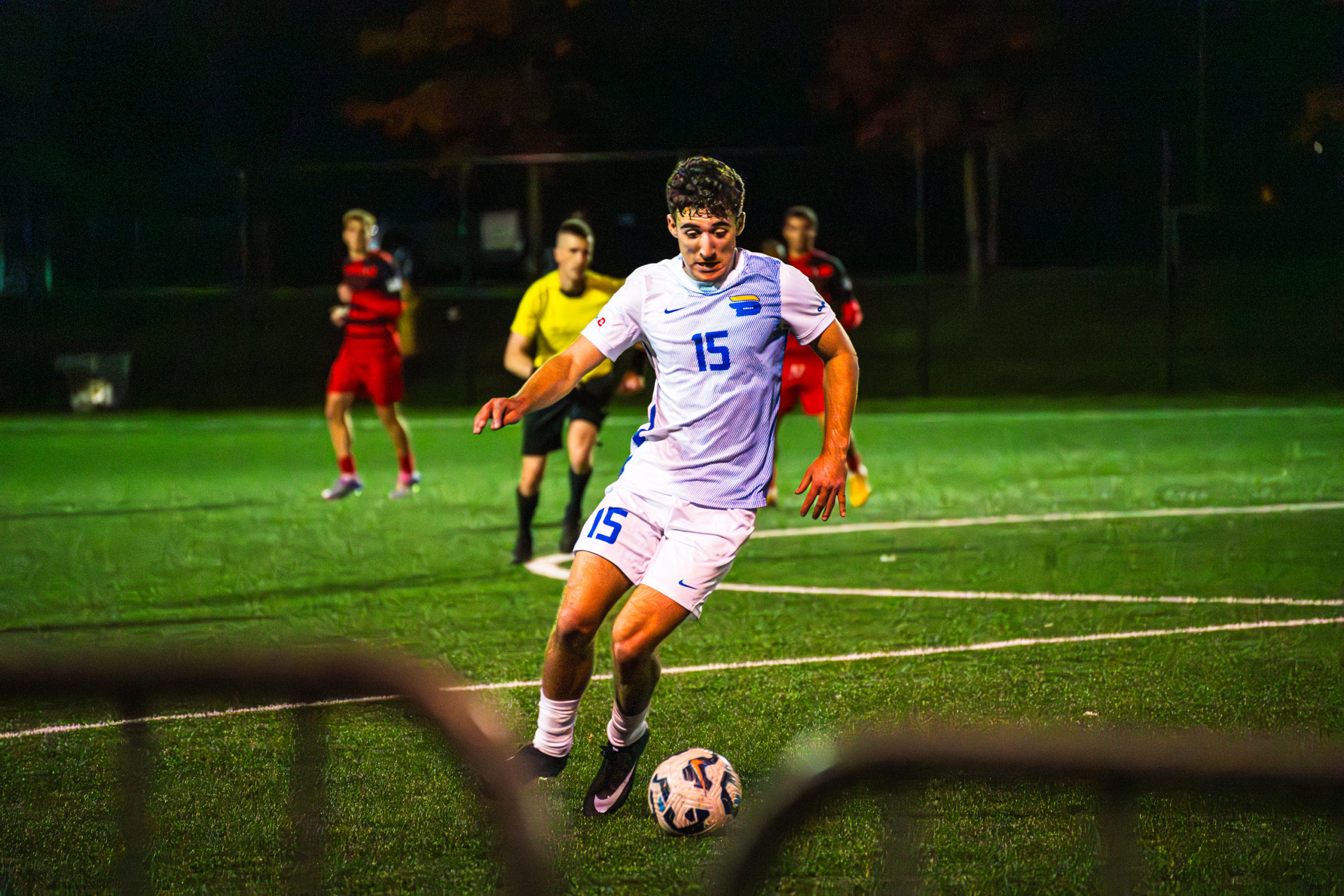 A TMU player maintains possession