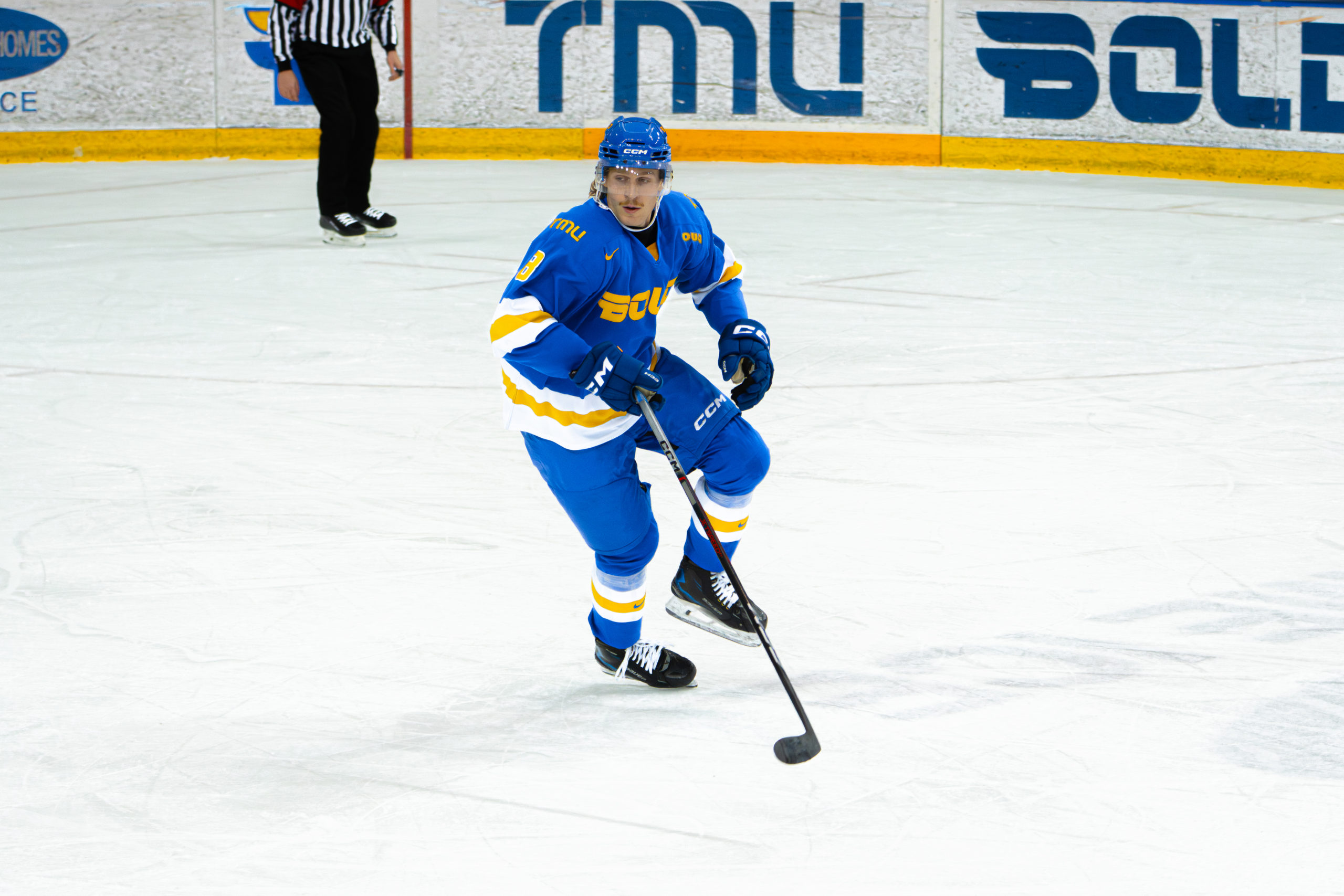 Bold player skating to the defensive end at the Mattamy Athletic Centre
