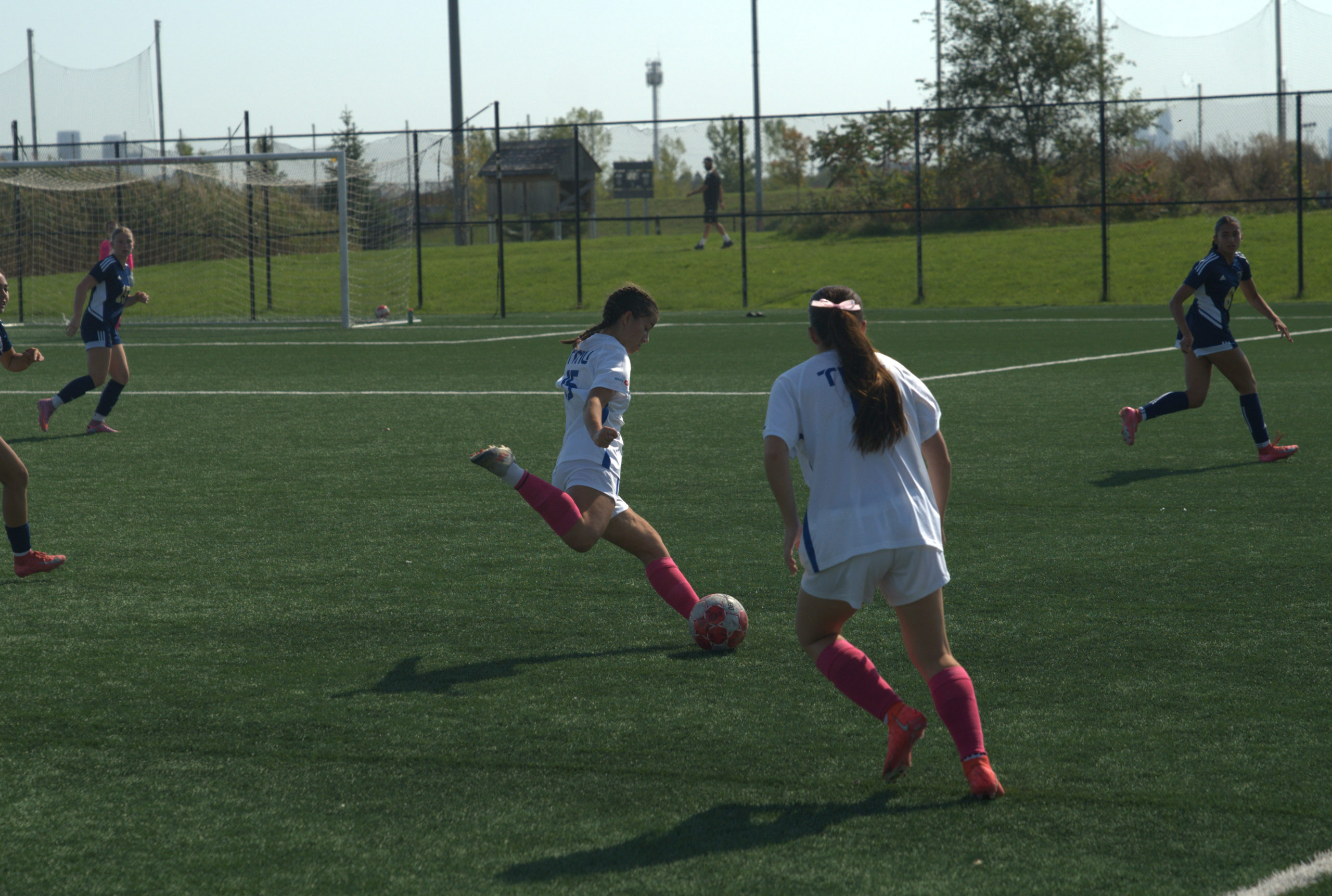 TMU gains possession of the ball and get closer to the net