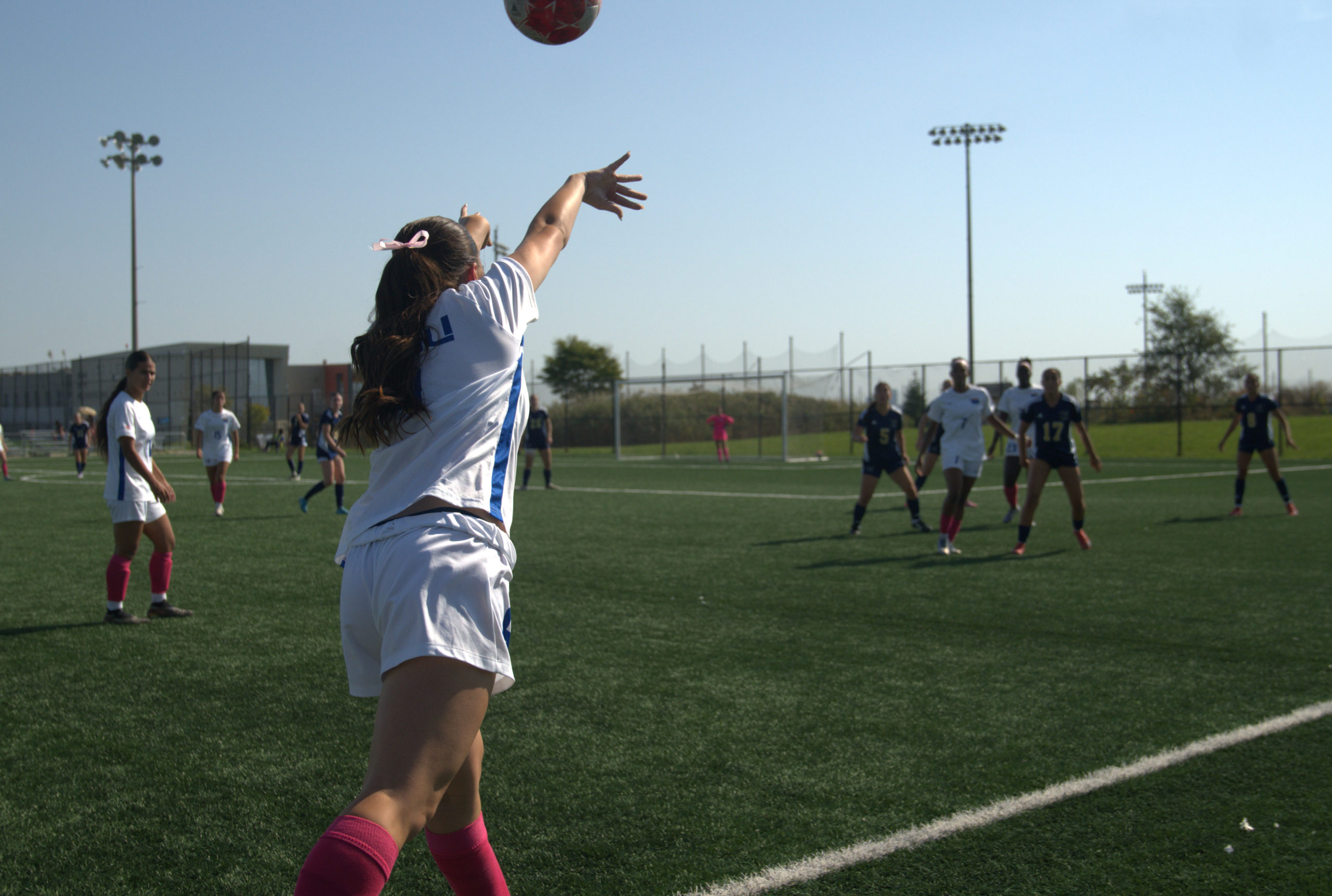 A TMU player throws the ball back into the field