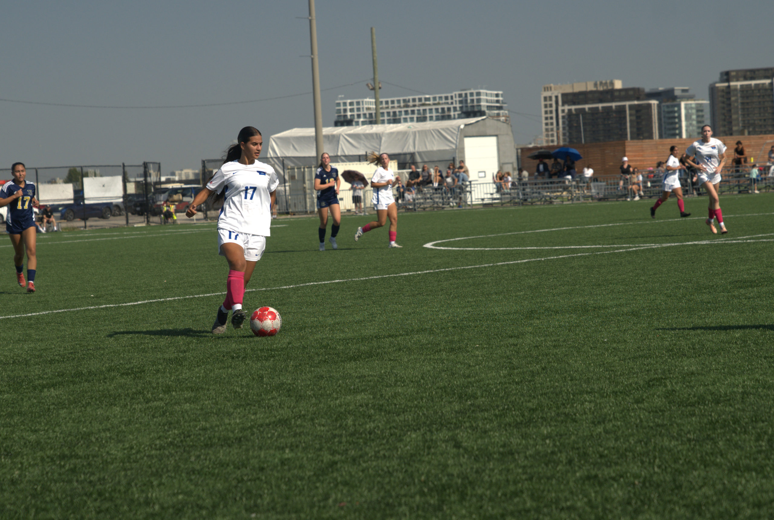 A TMU player gains possession of the ball