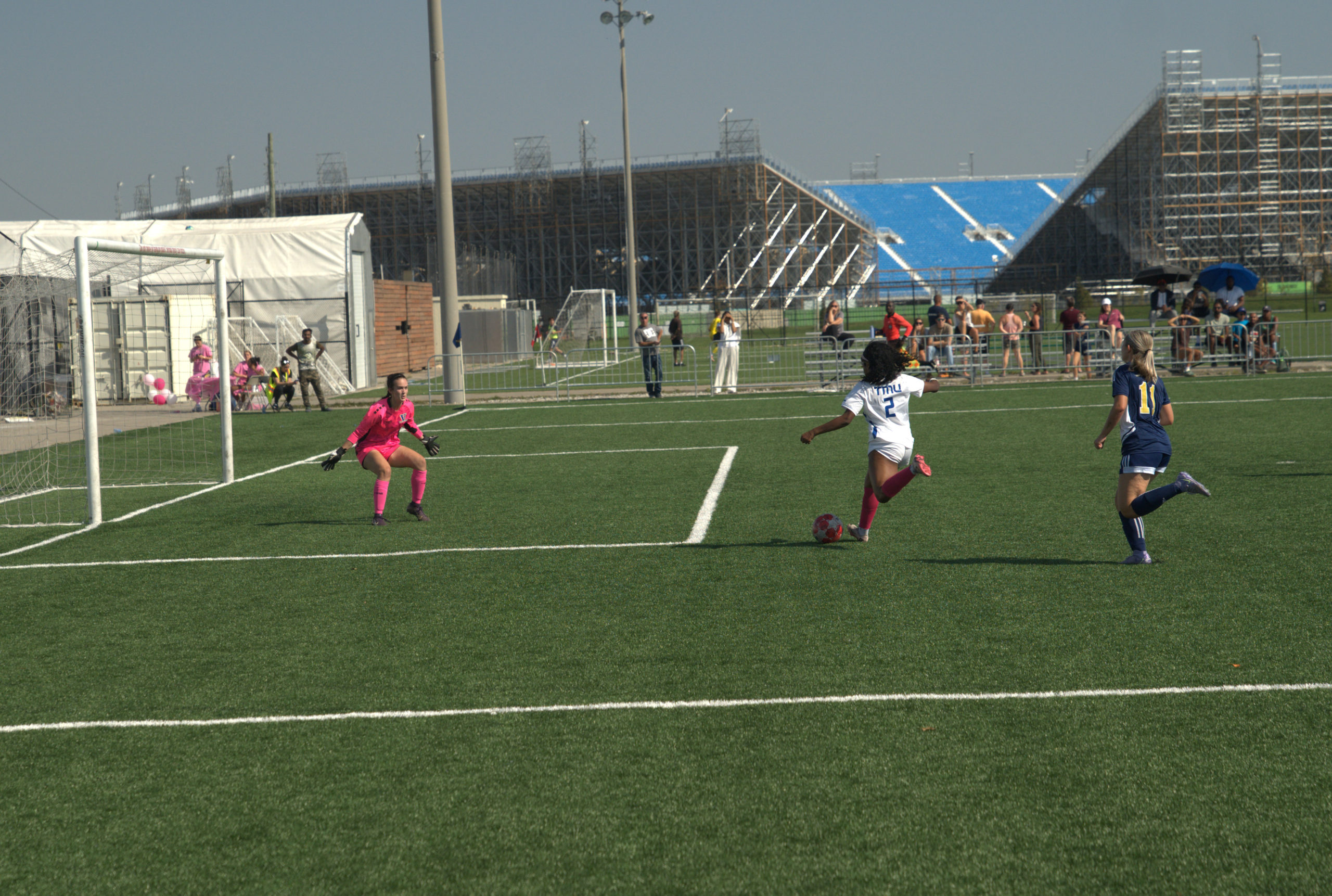 A TMU player makes a shot