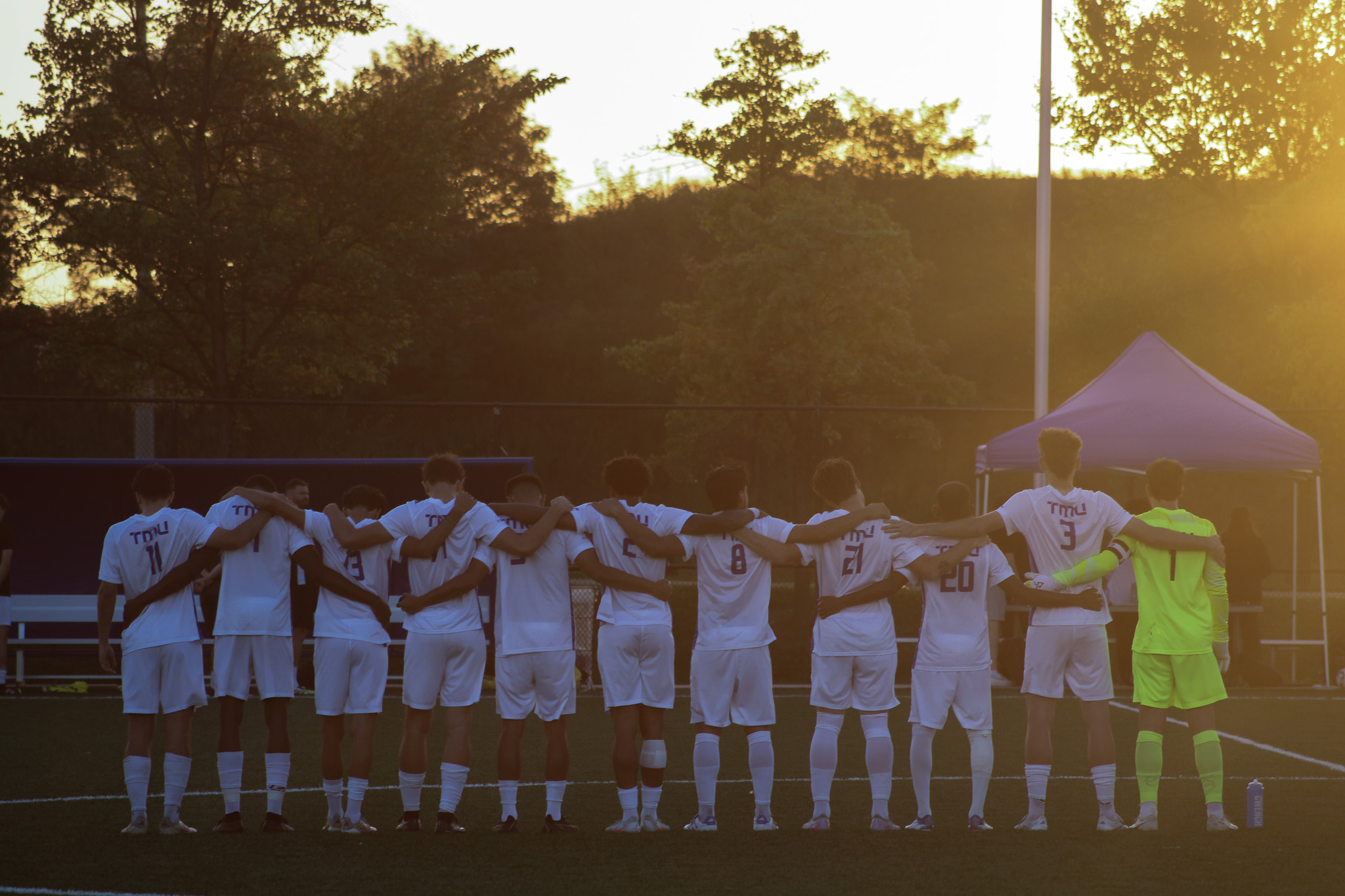 TMU huddles together before the game