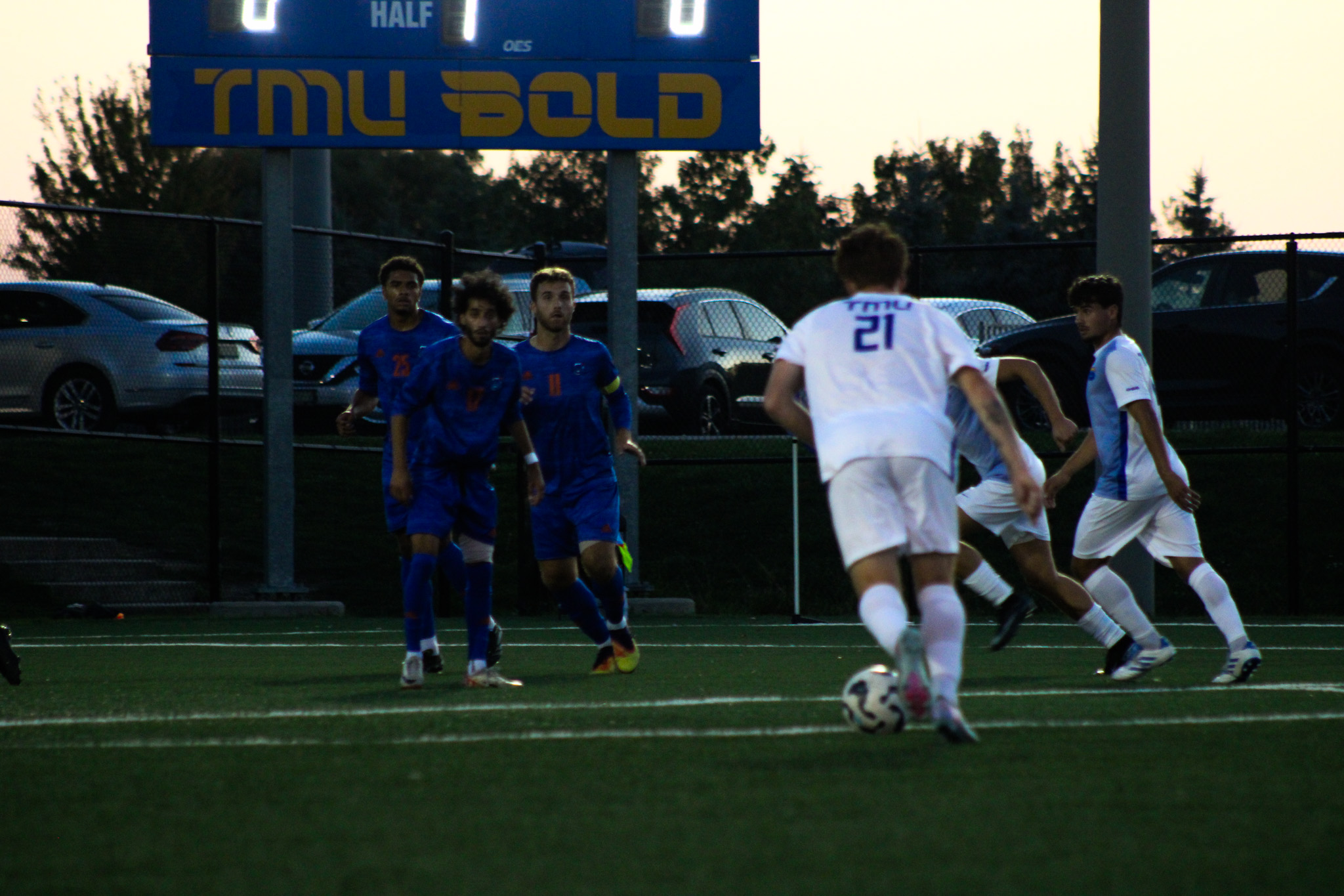 A TMU player prepares to make a pass