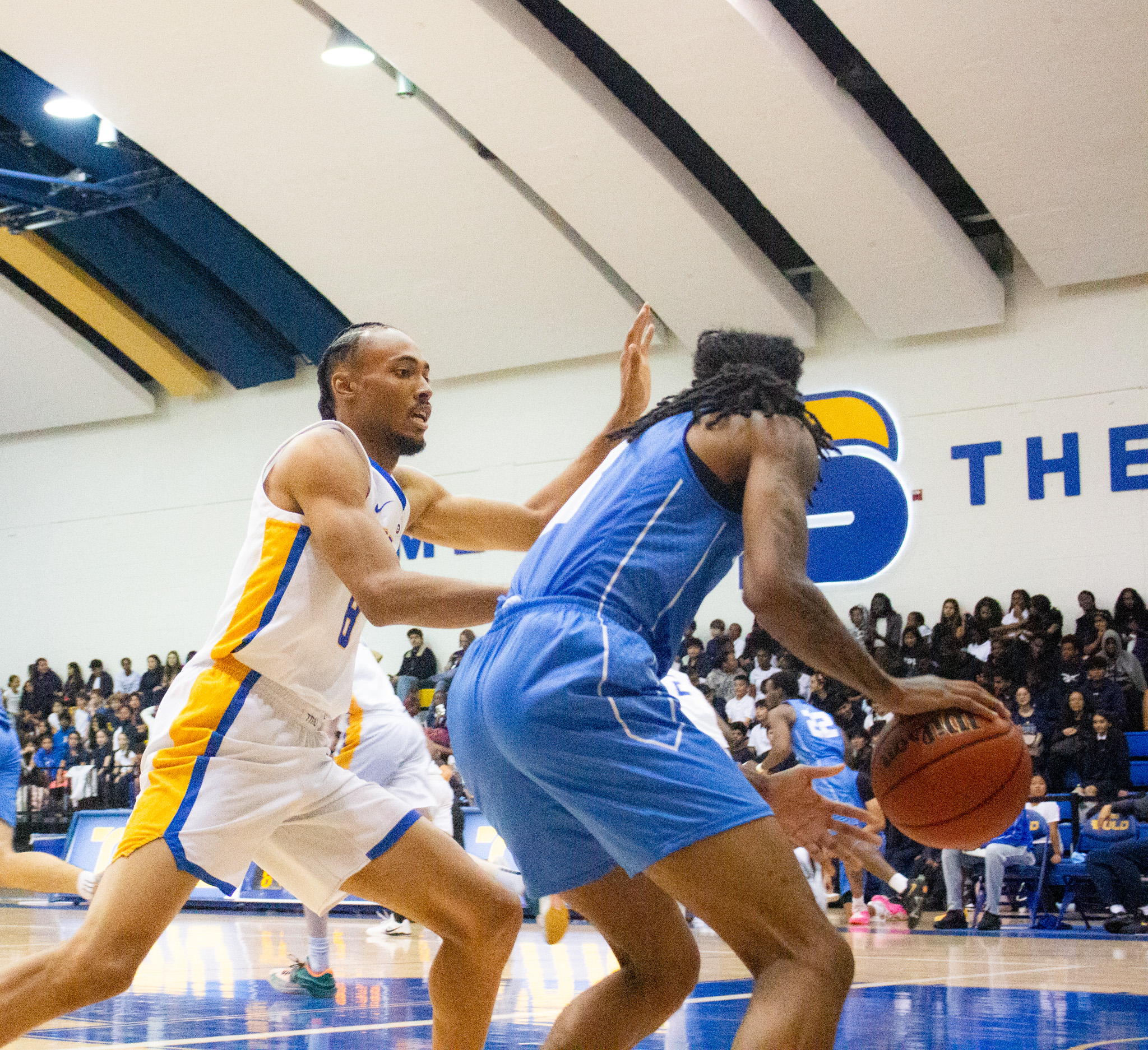 A TMU player tries to block a pass
