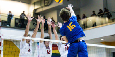 Kai Taylor going up for a hit against three York defenders