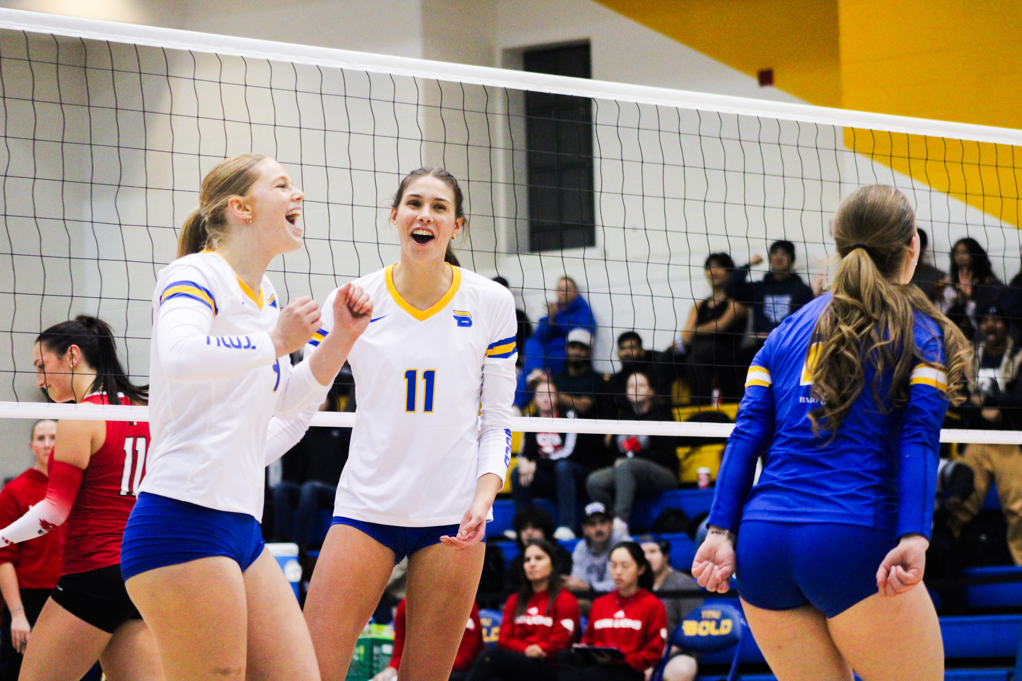 TMU players celebrating a point