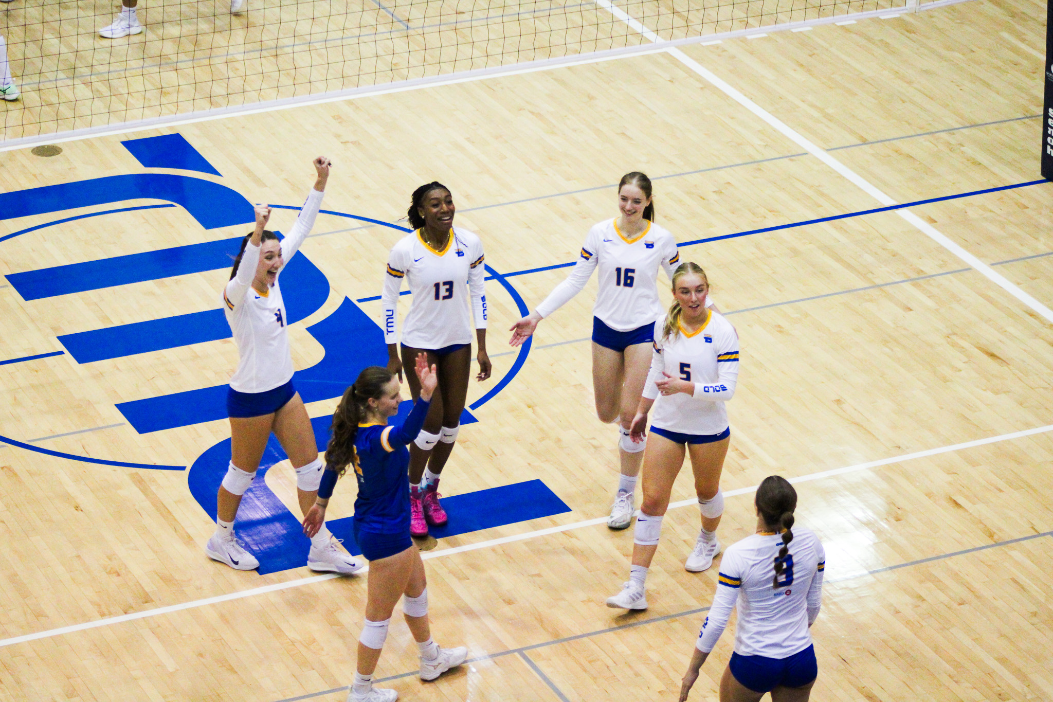 TMU players celebrating a point