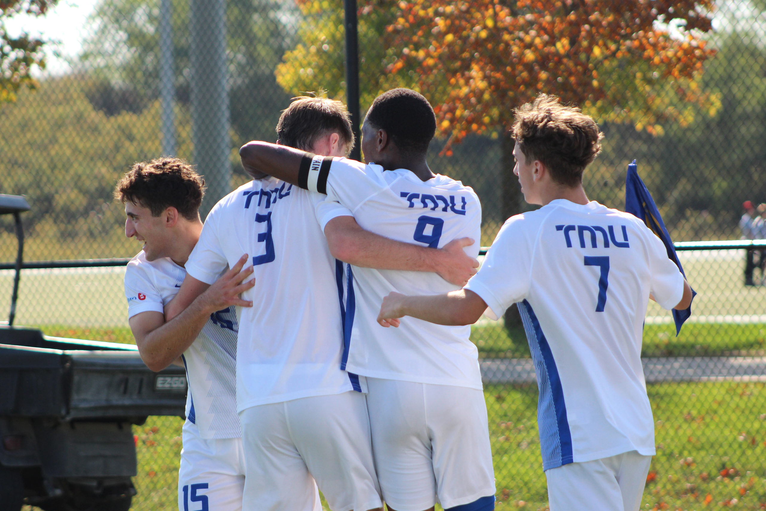 TMU celebrate with one another