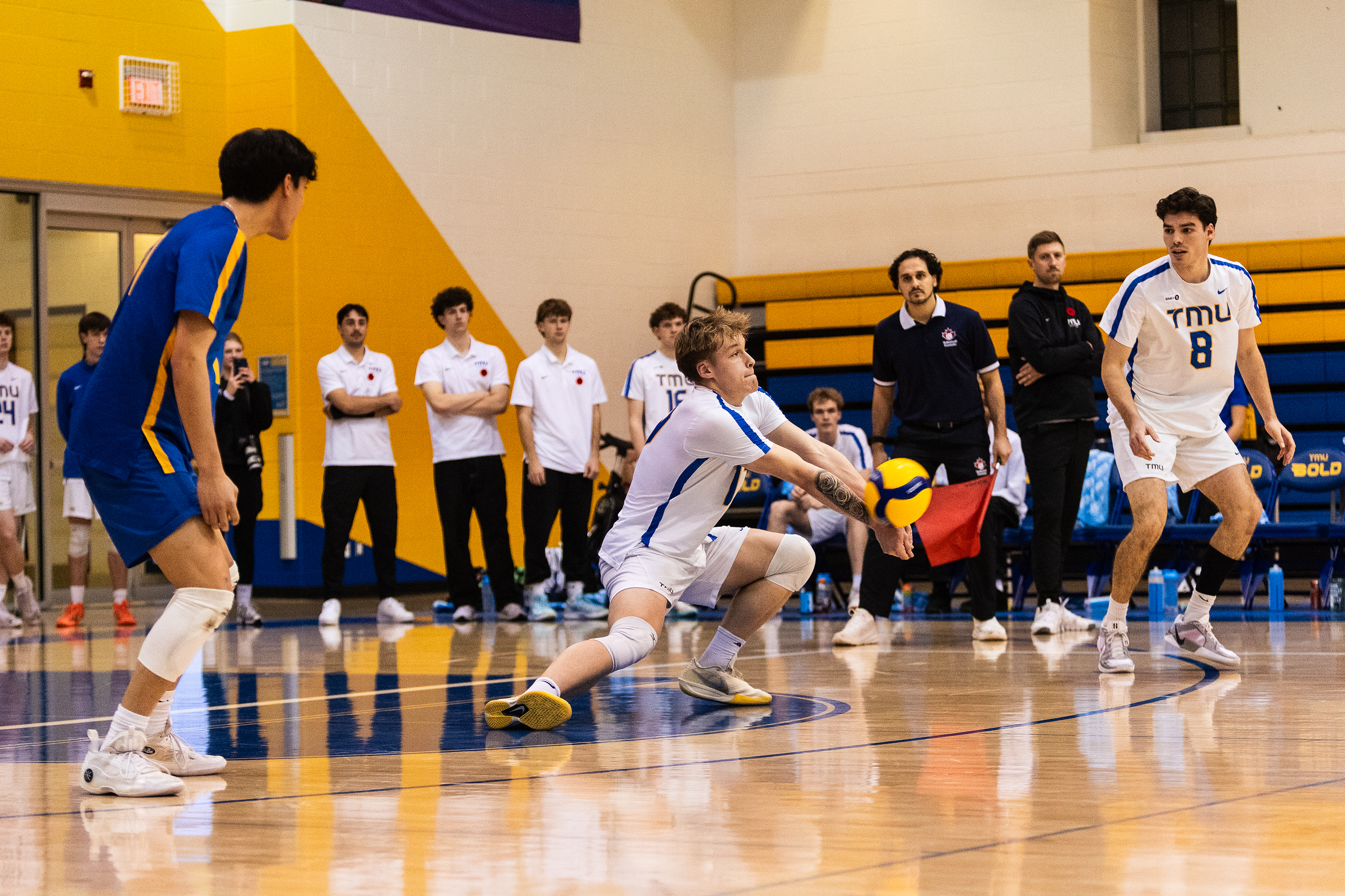 A TMU player tries to receive the ball