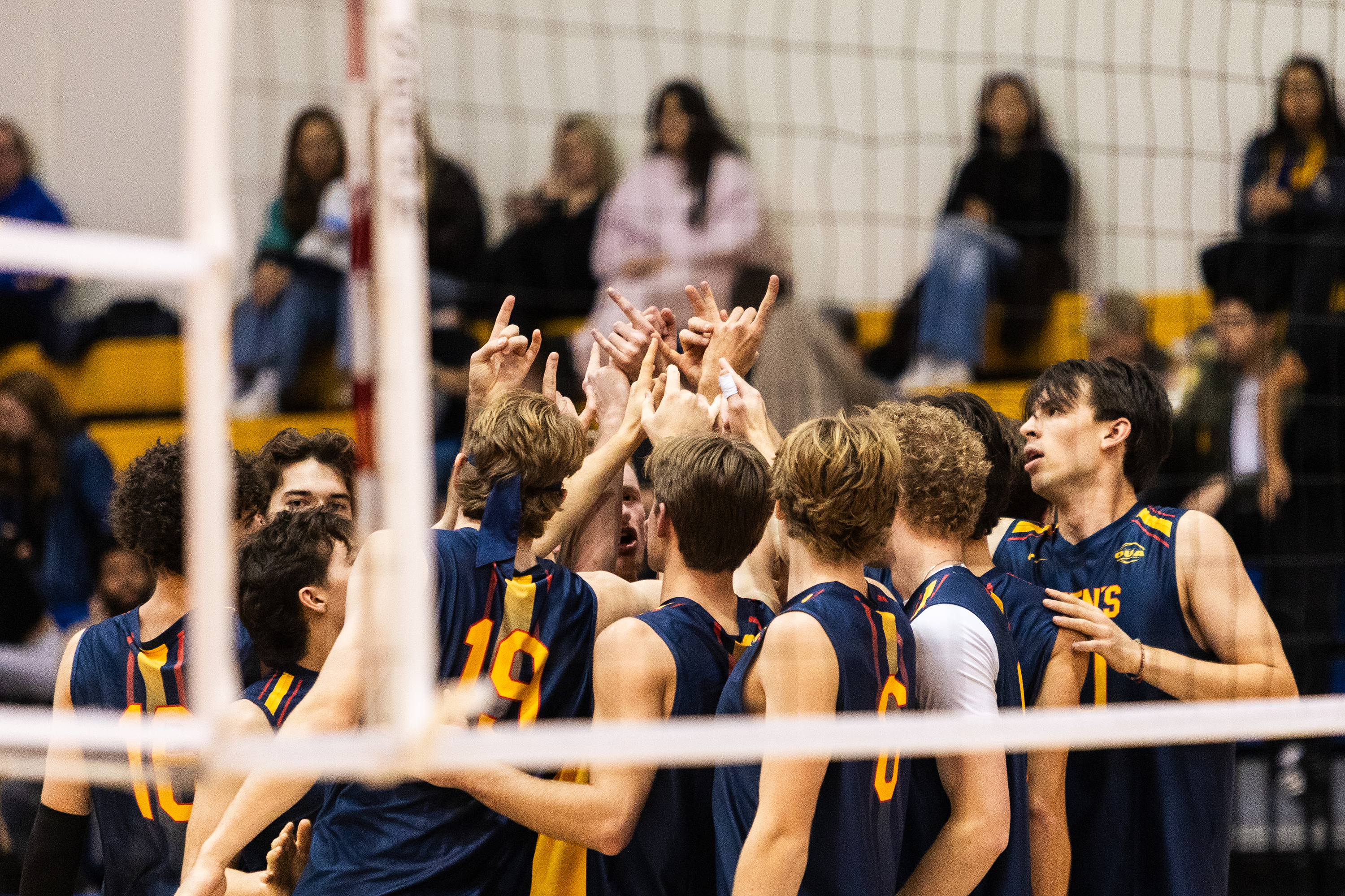 Queen's huddles together pre-game