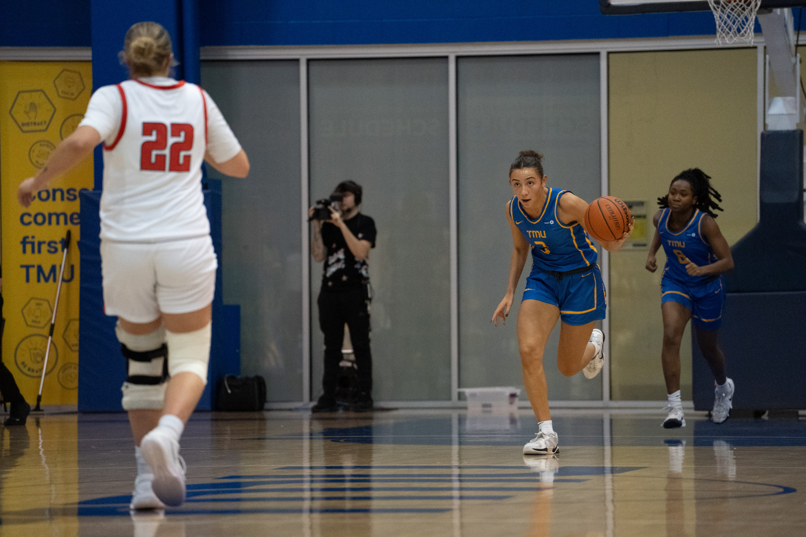 Hailey Franco DeRyck dribbling the ball up the court at the Mattamy Athletics Centre