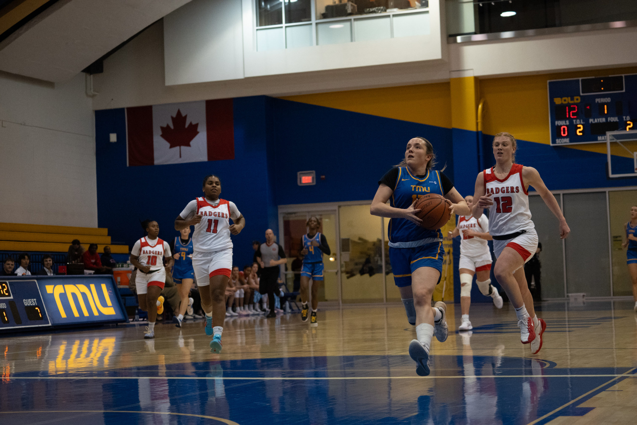Catrina Garvey gathering for a layup around the freethrow line on a fast break at the Mattamy Athletics Centre