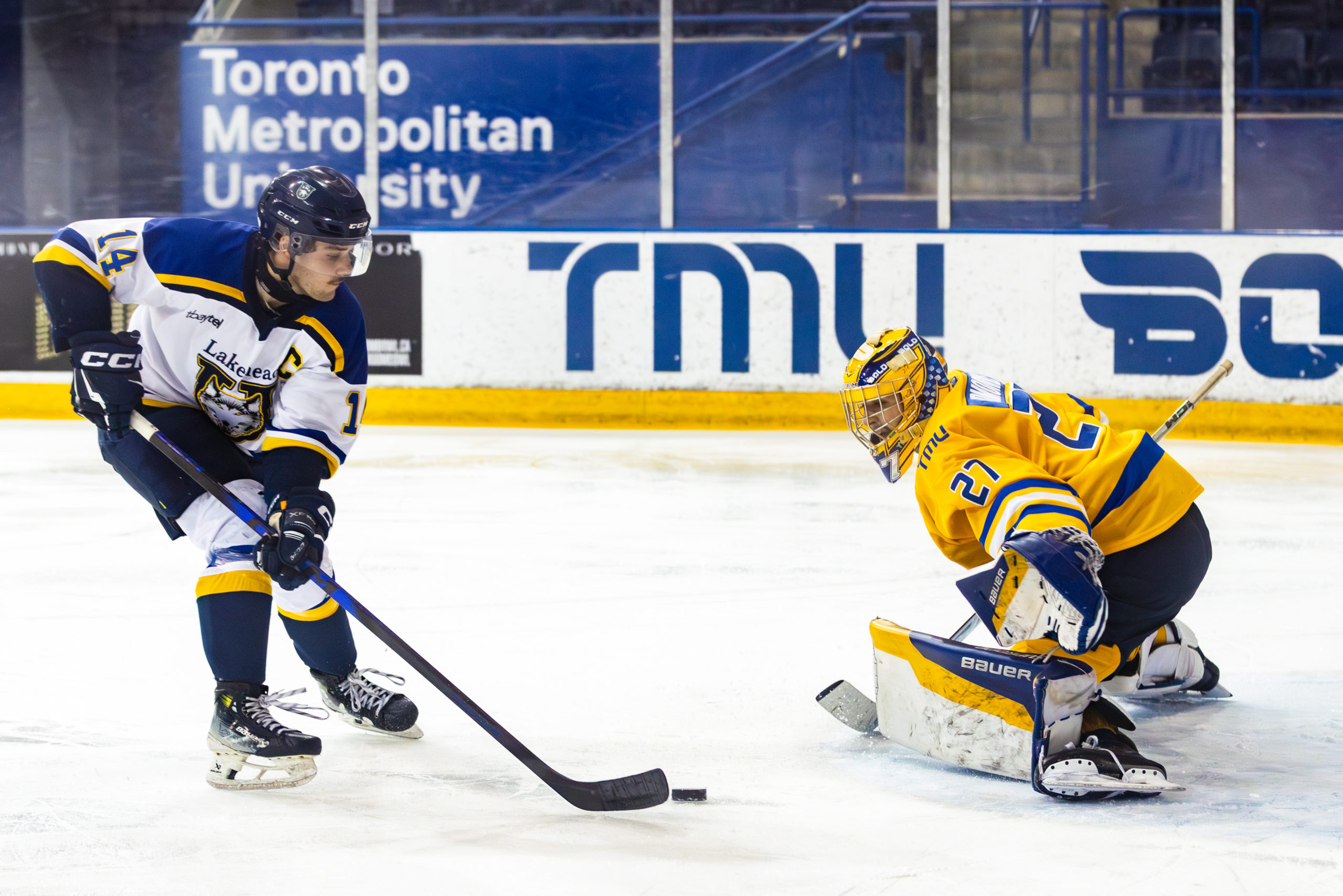 A Lakehead player attempts to weave the puck into the net