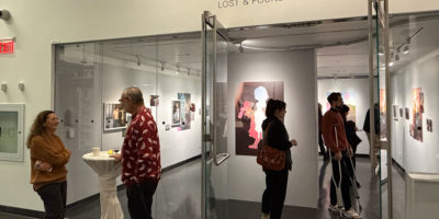 Image of an art exhibit at the Image Centre, there is a sign that reads "Jessica Berger" and Lost & Found."