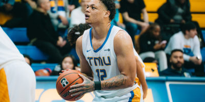 Aaron Rhooms holds the ball and sets his eyes on the basket