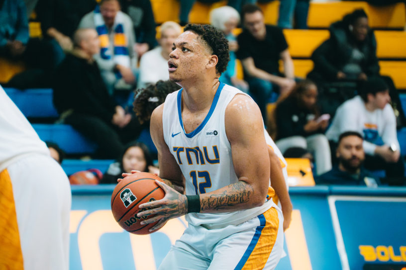 Aaron Rhooms holds the ball and sets his eyes on the basket