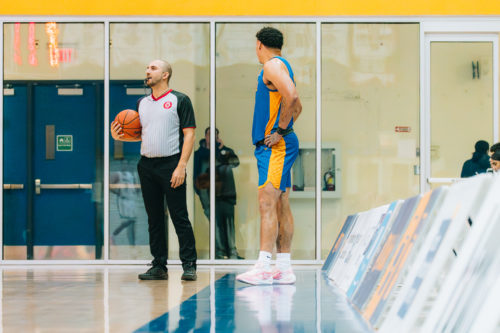Aaron Rhooms looking at a referee to receive the ball to put the ball in bounds at the Mattamy Athletics Centre