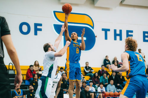 Deandre Goulbourne shooting a contested right hand push shot at the Mattamy Athletics Centre