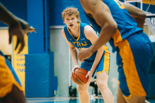 A TMU player in a triple threat position at the Mattamy Athletics Centre
