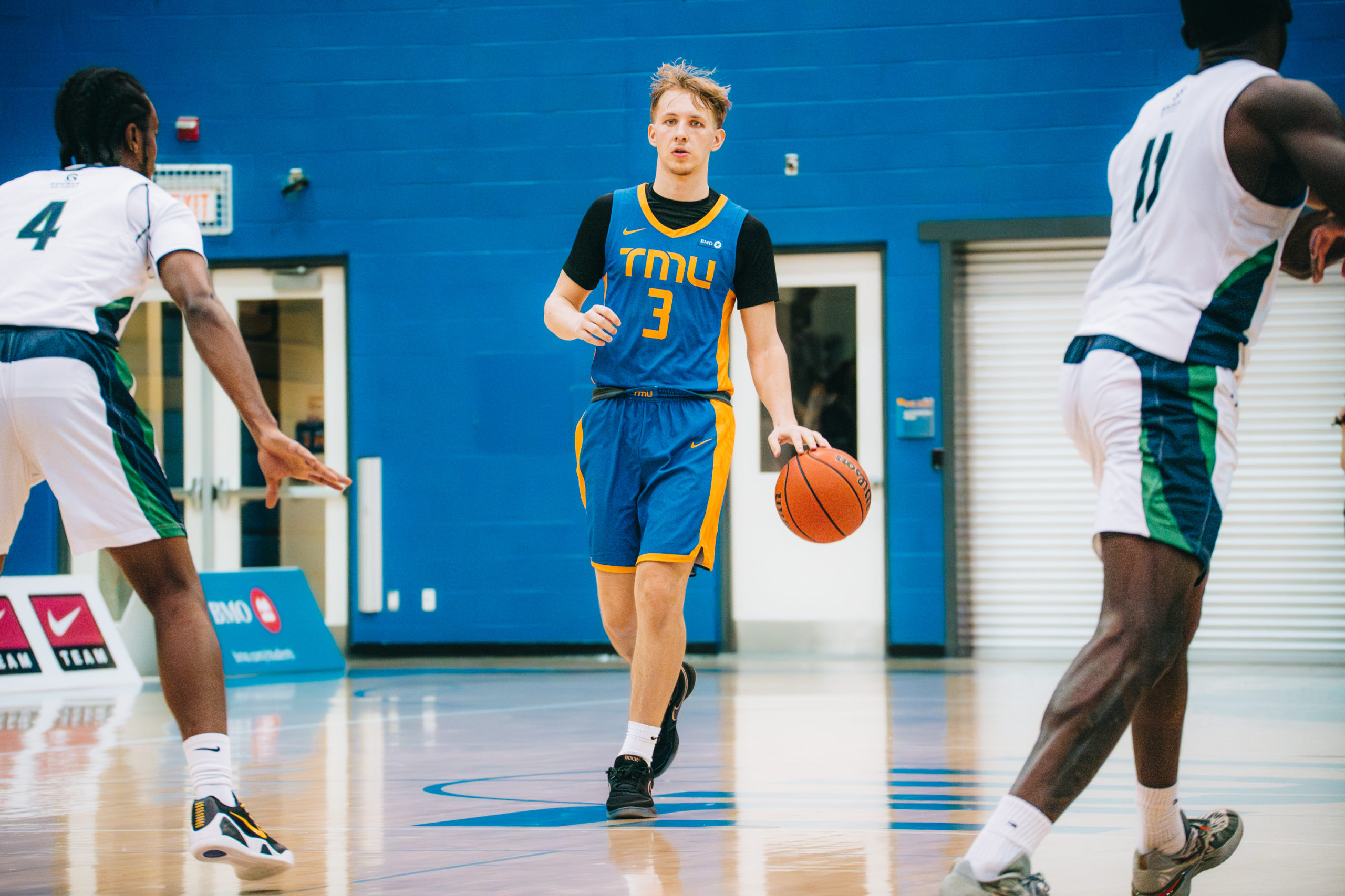 Kevin Toth dribbling up the court at the Mattamy Athletics Centre
