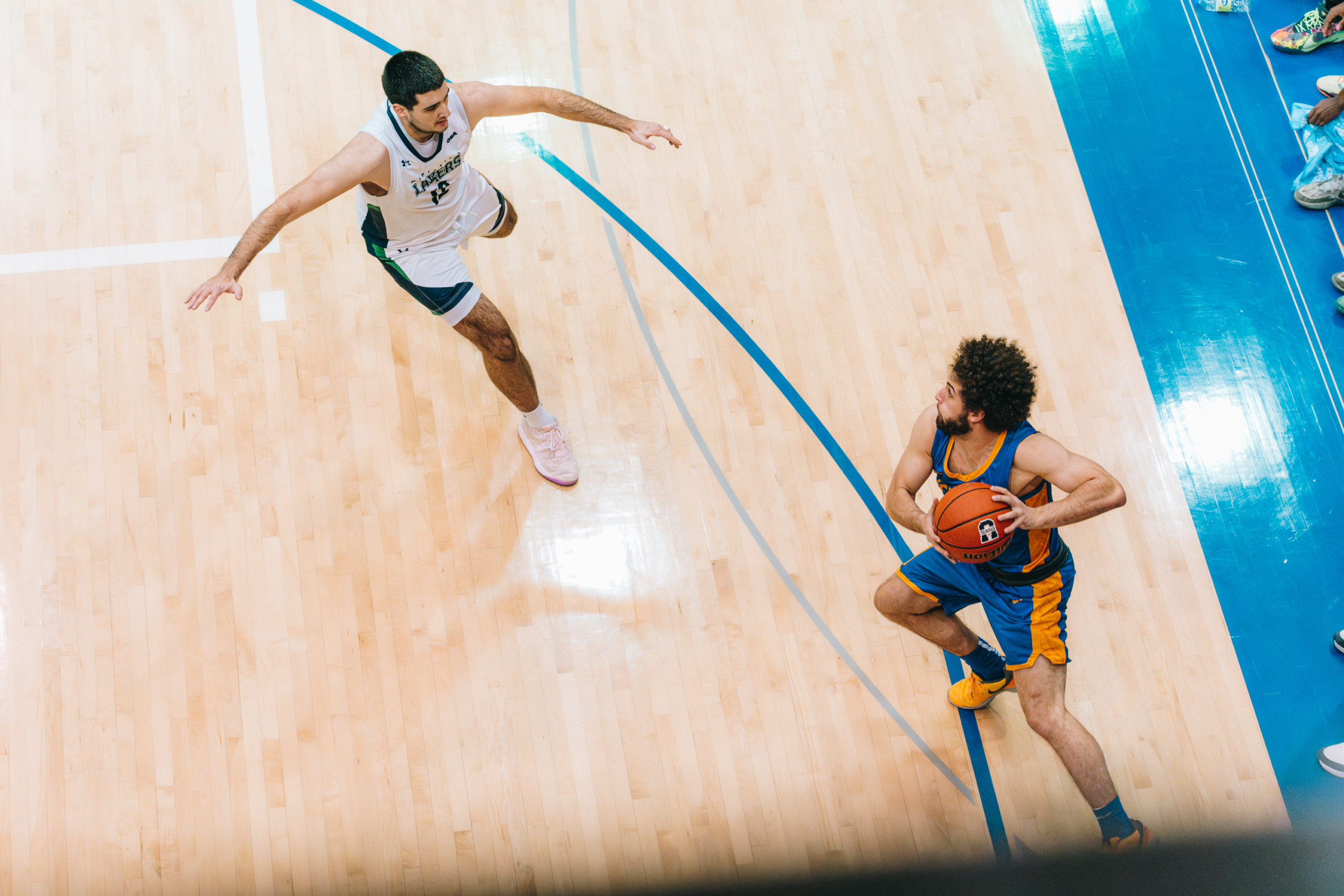 A TMU player catching the ball in the corner at the Mattamy Athletics Centre