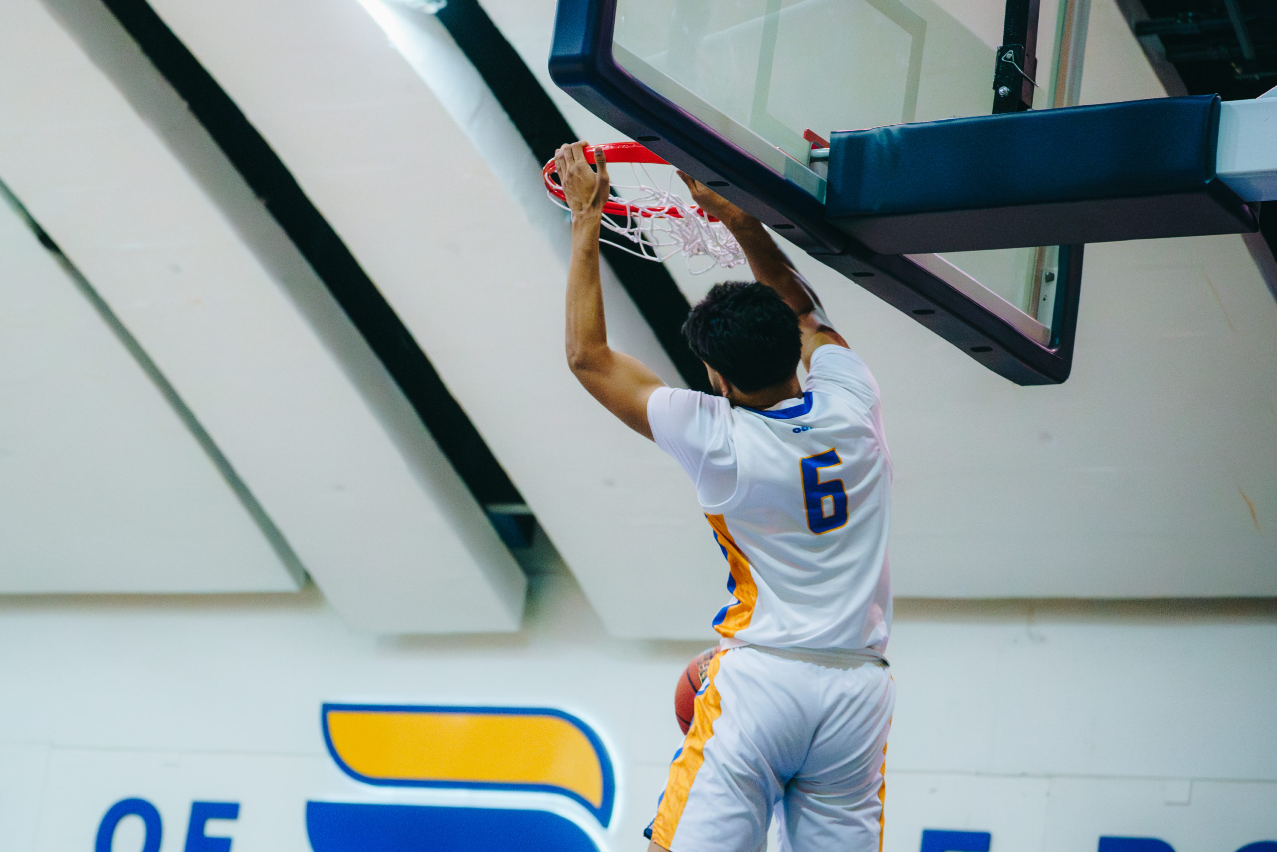A TMU player makes a basket