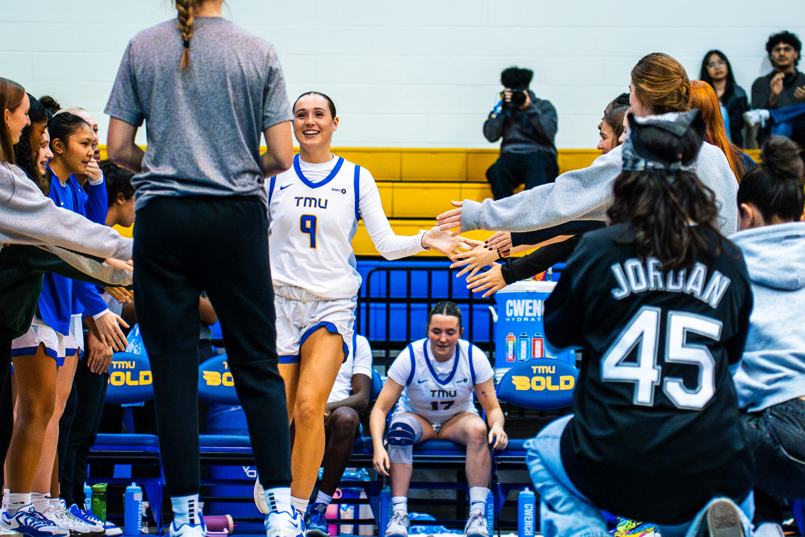 A women's basketball player approaches the court pre-game