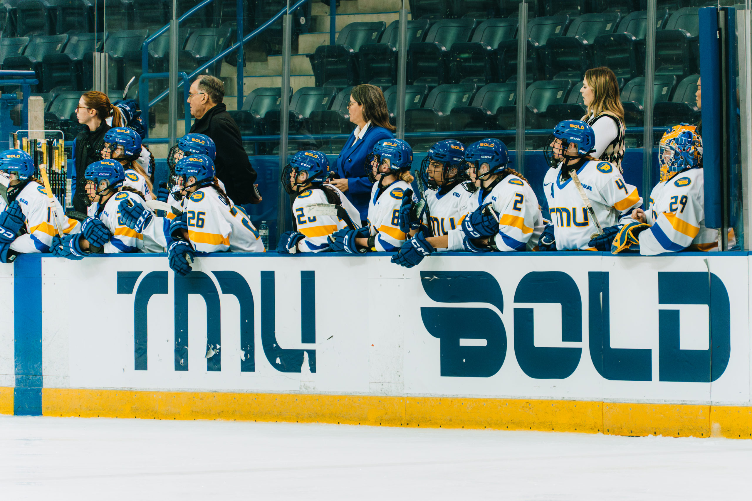 The TMU Bold women's hockey team bench viewing a play at the Mattamy Athletics Centre