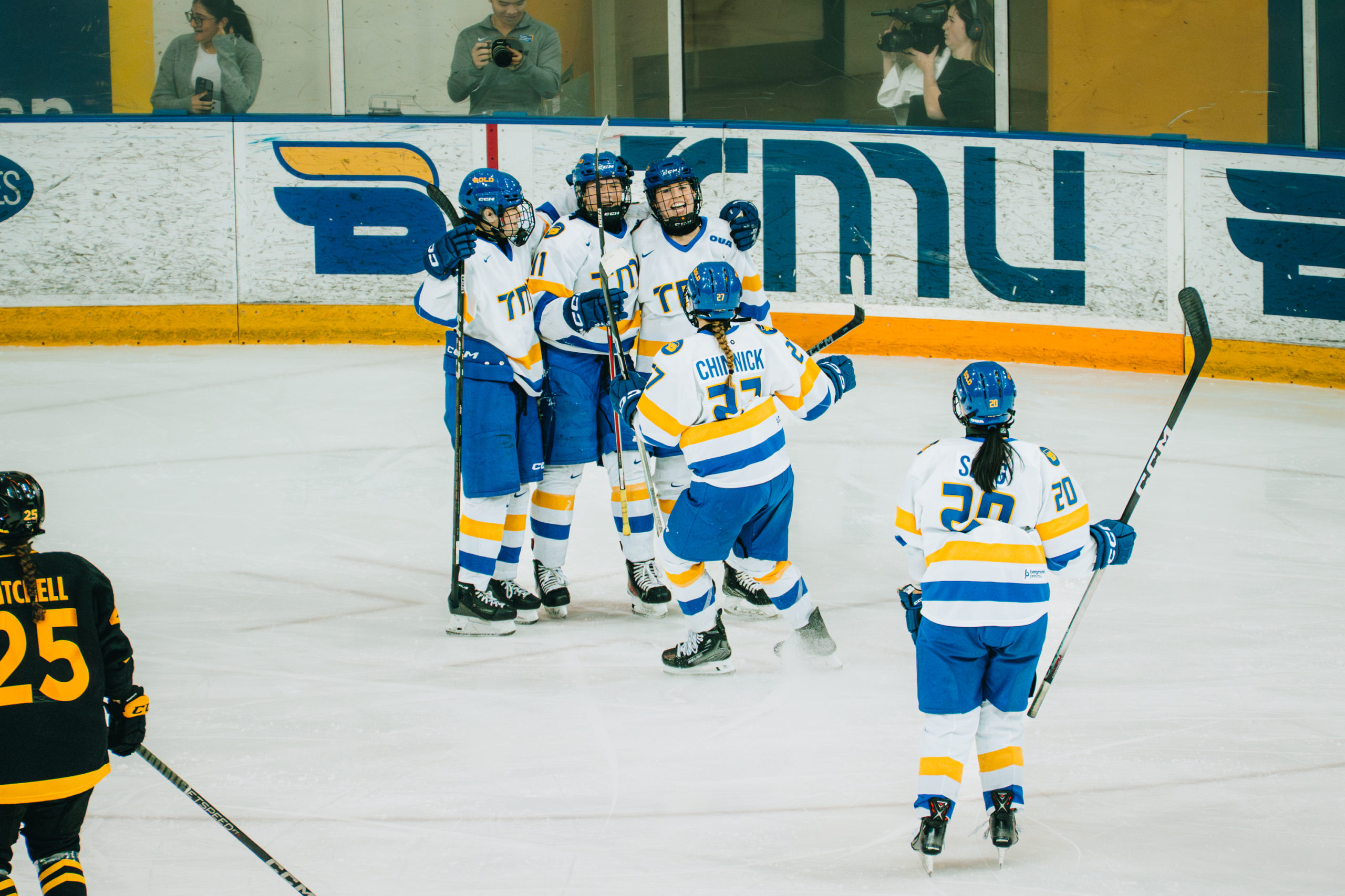 The TMU women's hockey team celebrating a goal at the Mattamy Athletics Centre