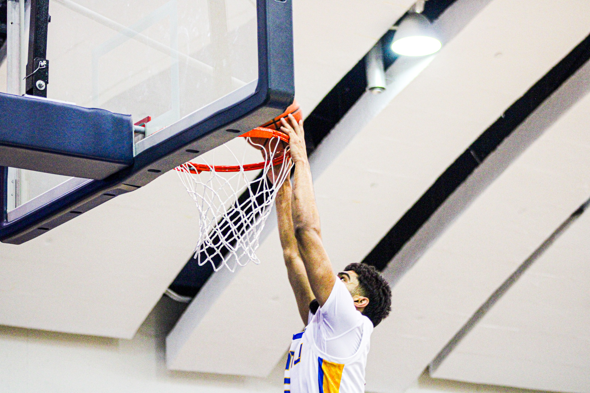 Gurdeep Kalsi going up for a two handed dunk