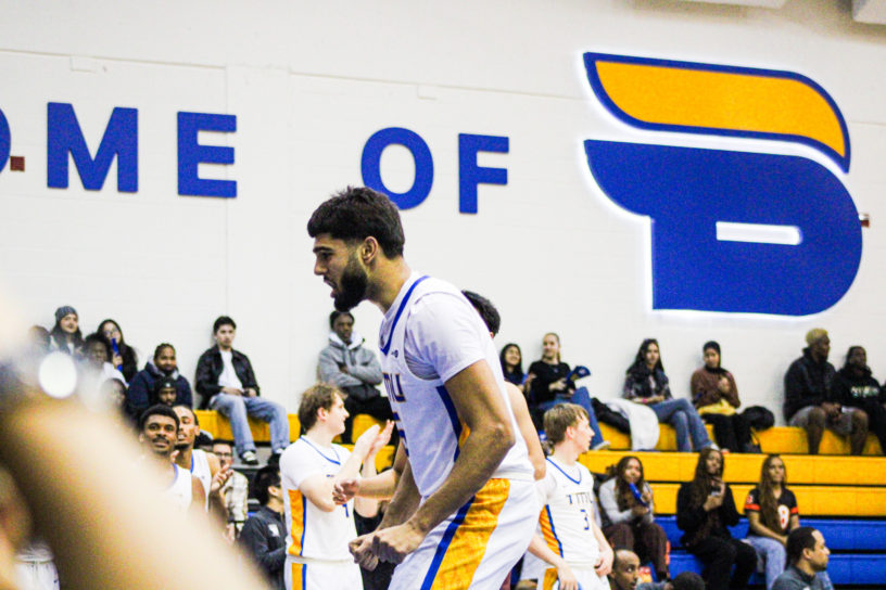 Gurdeep Kalsi in a stance after scoring a bucket