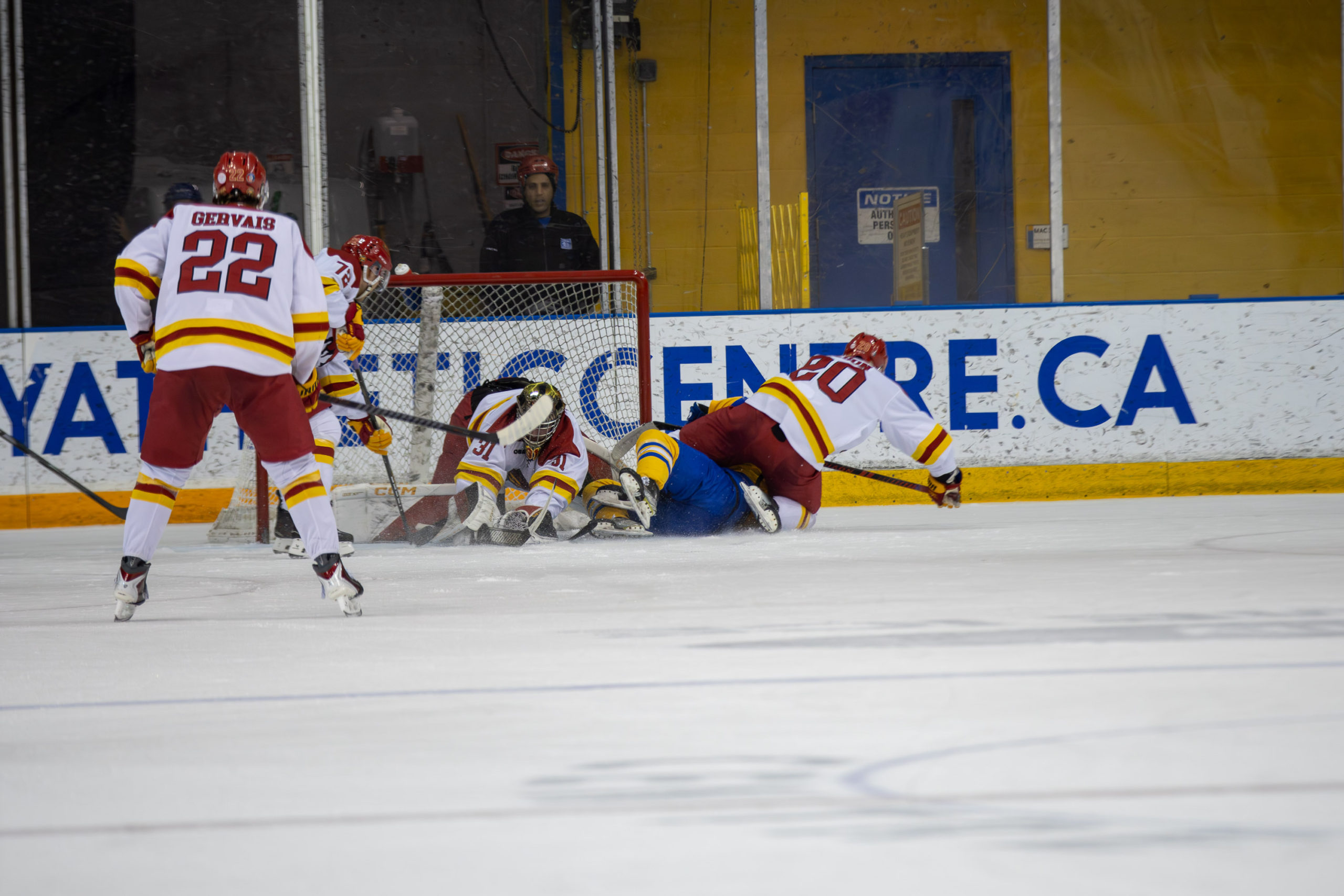 TMU and Guelph scramble in front of the net