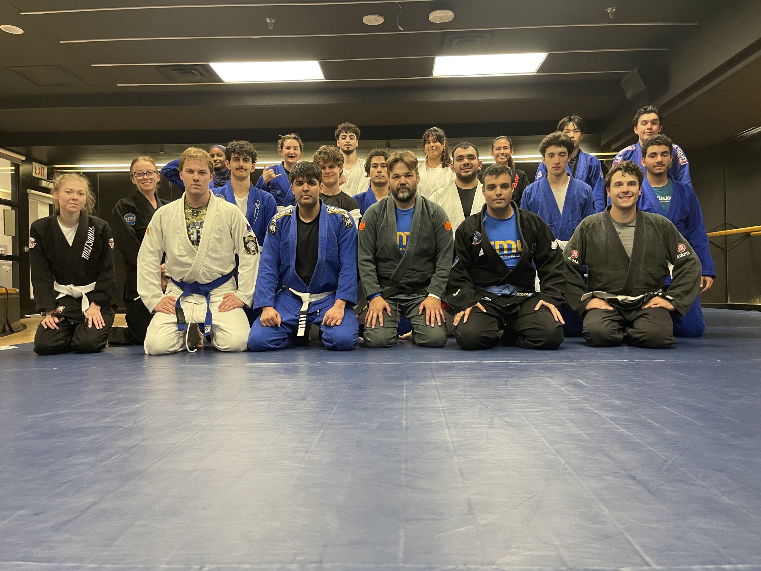 TMU's Brazilian Jiu-Jitsu club sits shoulder to shoulder at practice