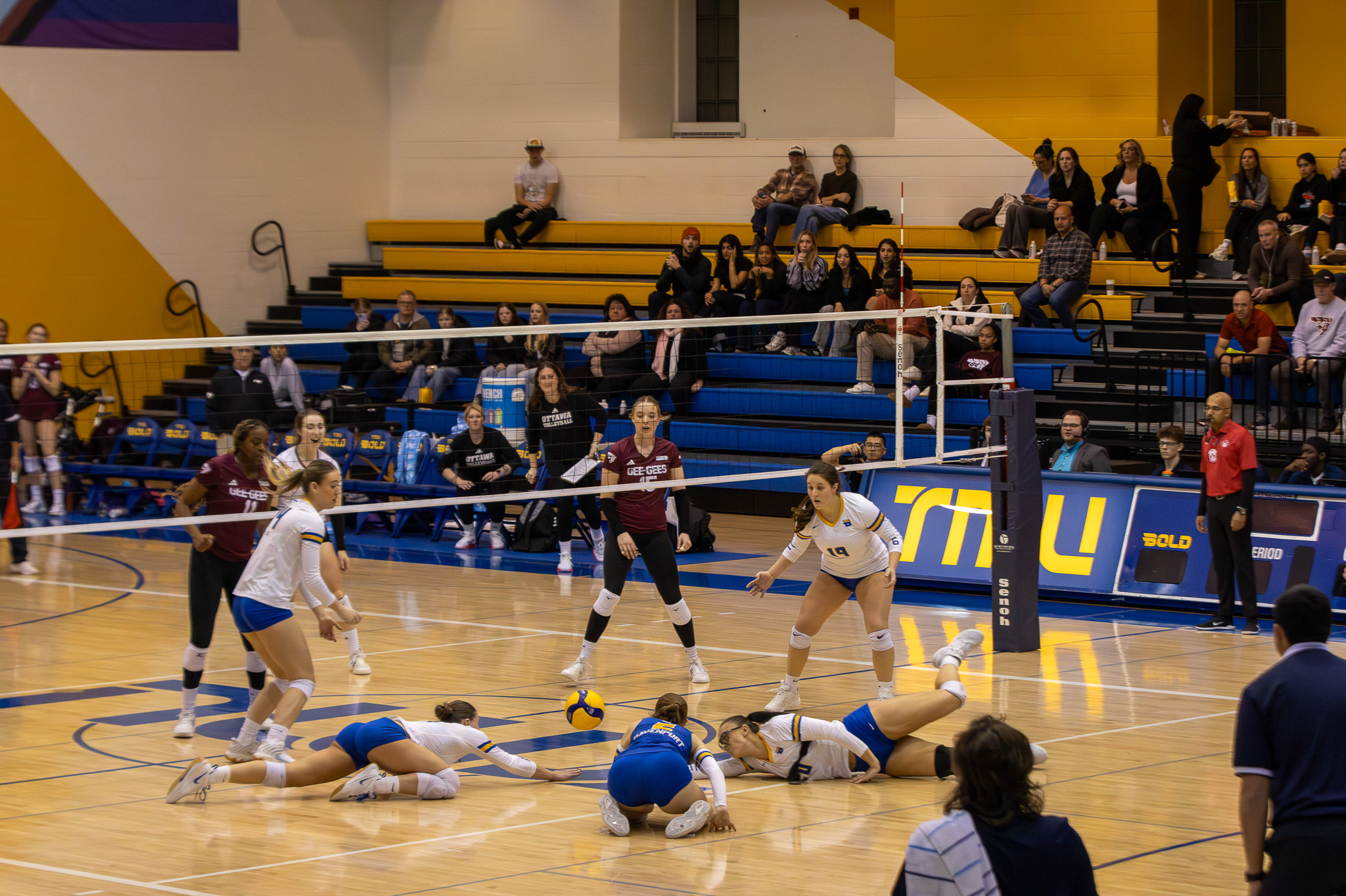 TMU players dive to the floor to save a point