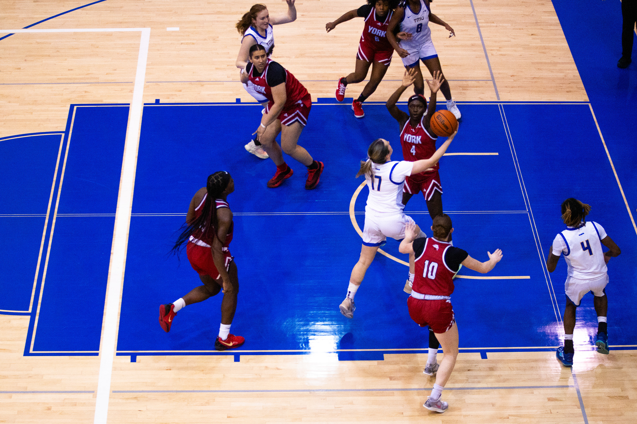 Catrina Garvey going for a contested right hand layup at the Mattamy Athletics Centre