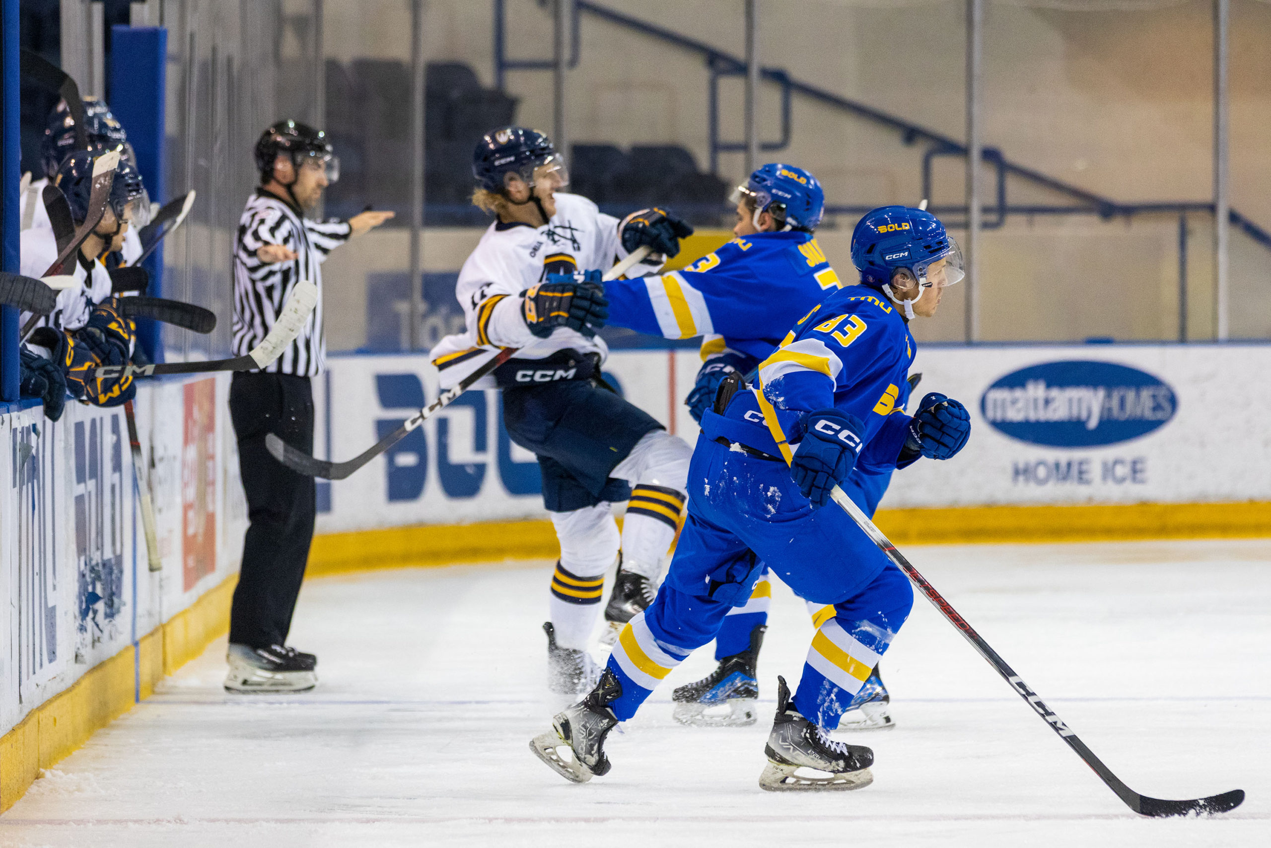 A scrum ensues on the ice