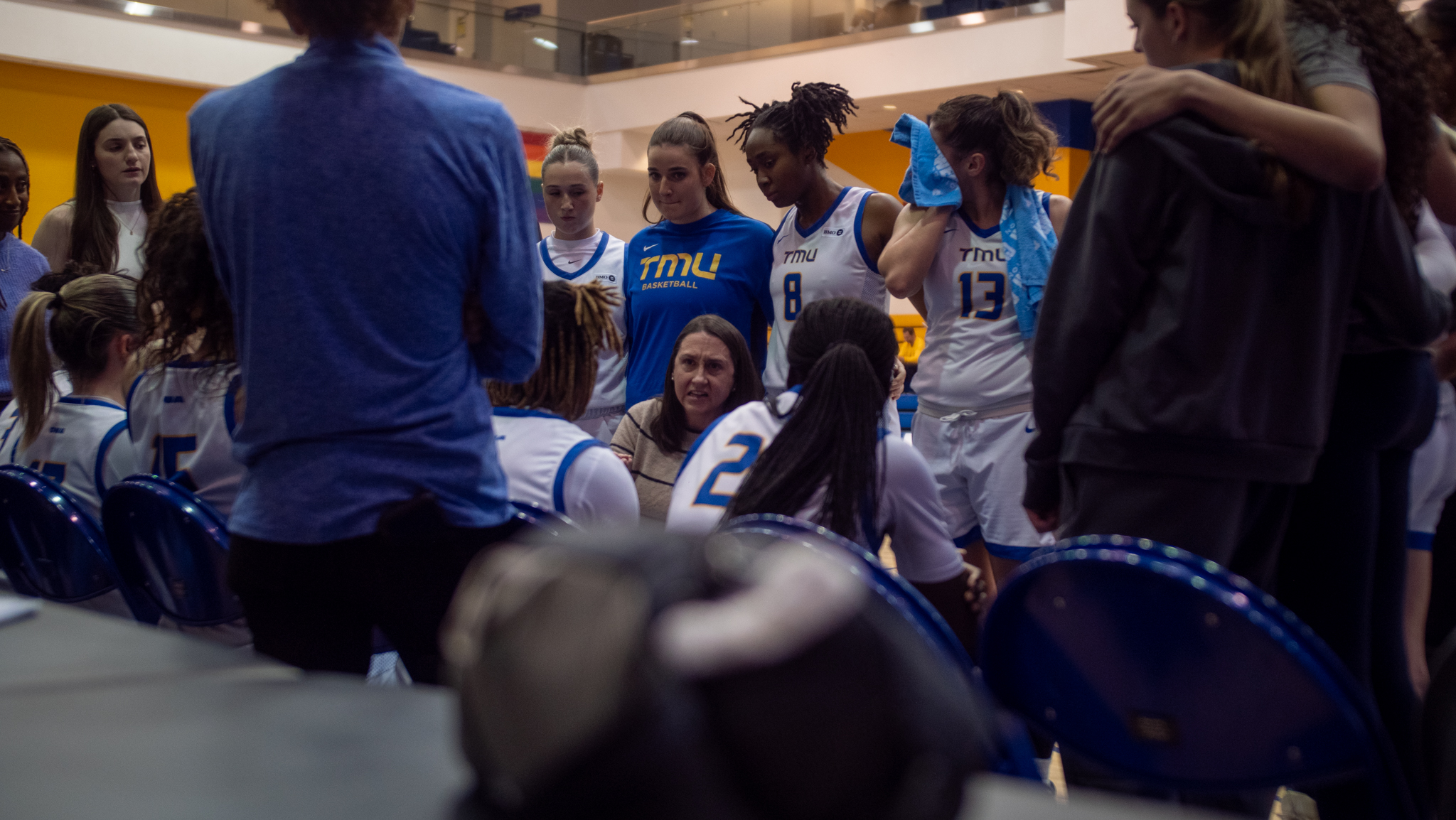 Head coach Carly Clarke talks to her team