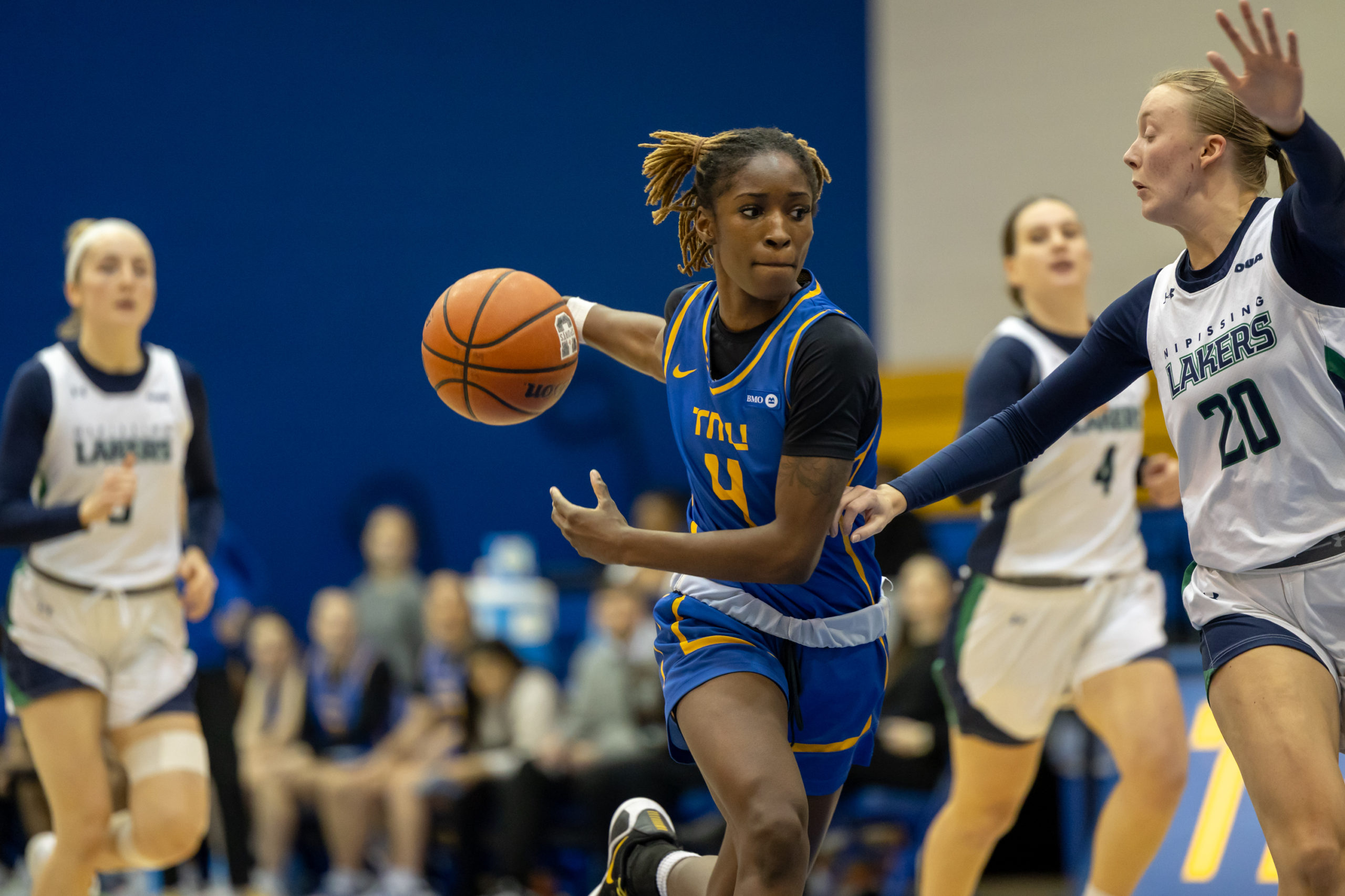 Myriam Kone weaves her way around a Nipissing defender