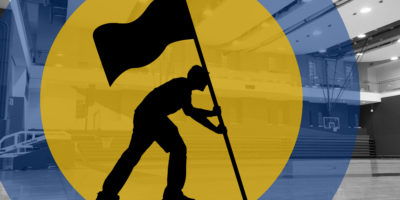 Silhouette of a person holding a flag in a basketball court with illustrations of blue and yellow circles surrounding them.