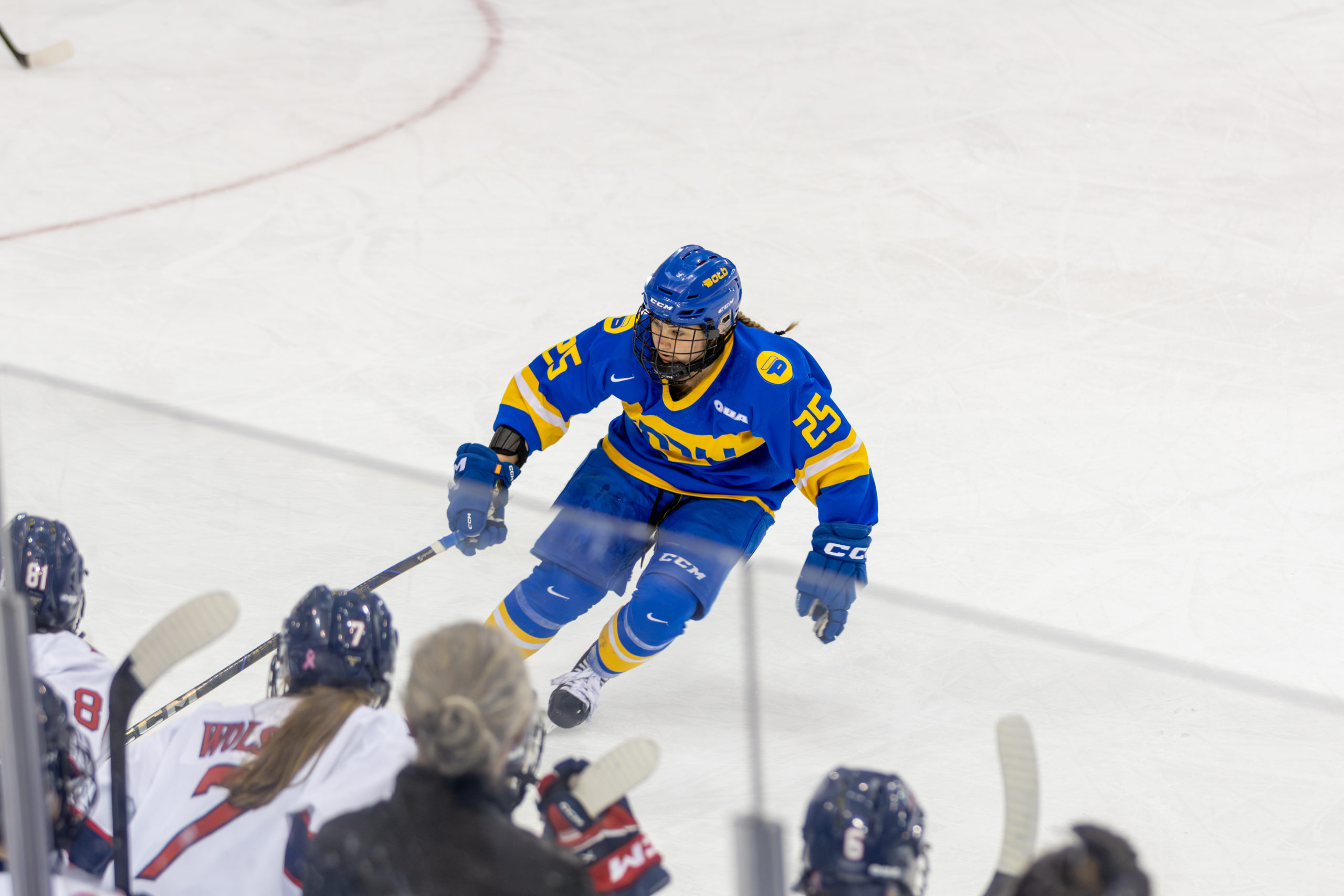 TMU Bold women's hockey player defending a play at the Mattamy Athletics Centre 