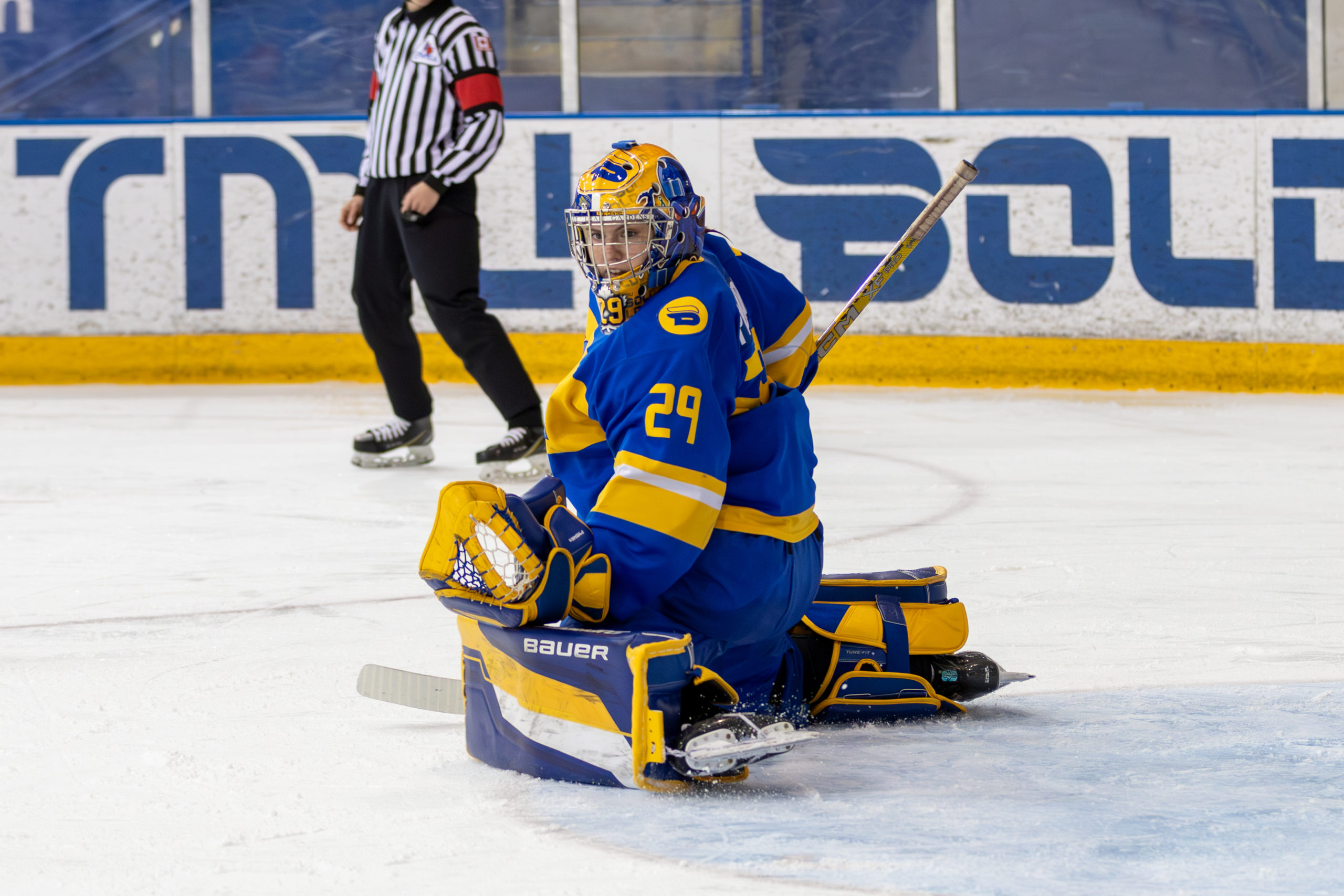 Sydney Pyburn with in a grounded defensive  n front of the net at the Mattamy Athletics Centre