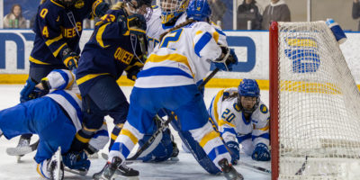 TMU and Queen's crowd around TMU's net
