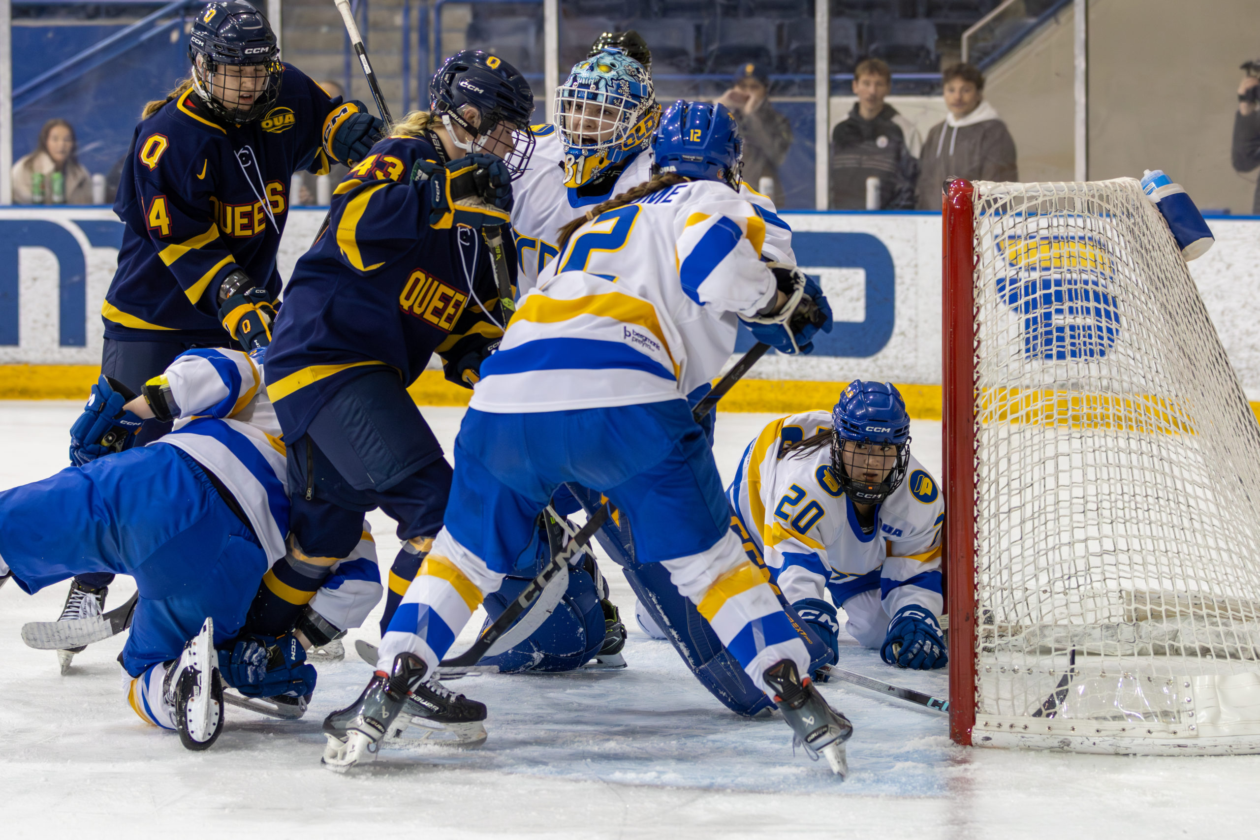 TMU and Queen's crowd around TMU's net