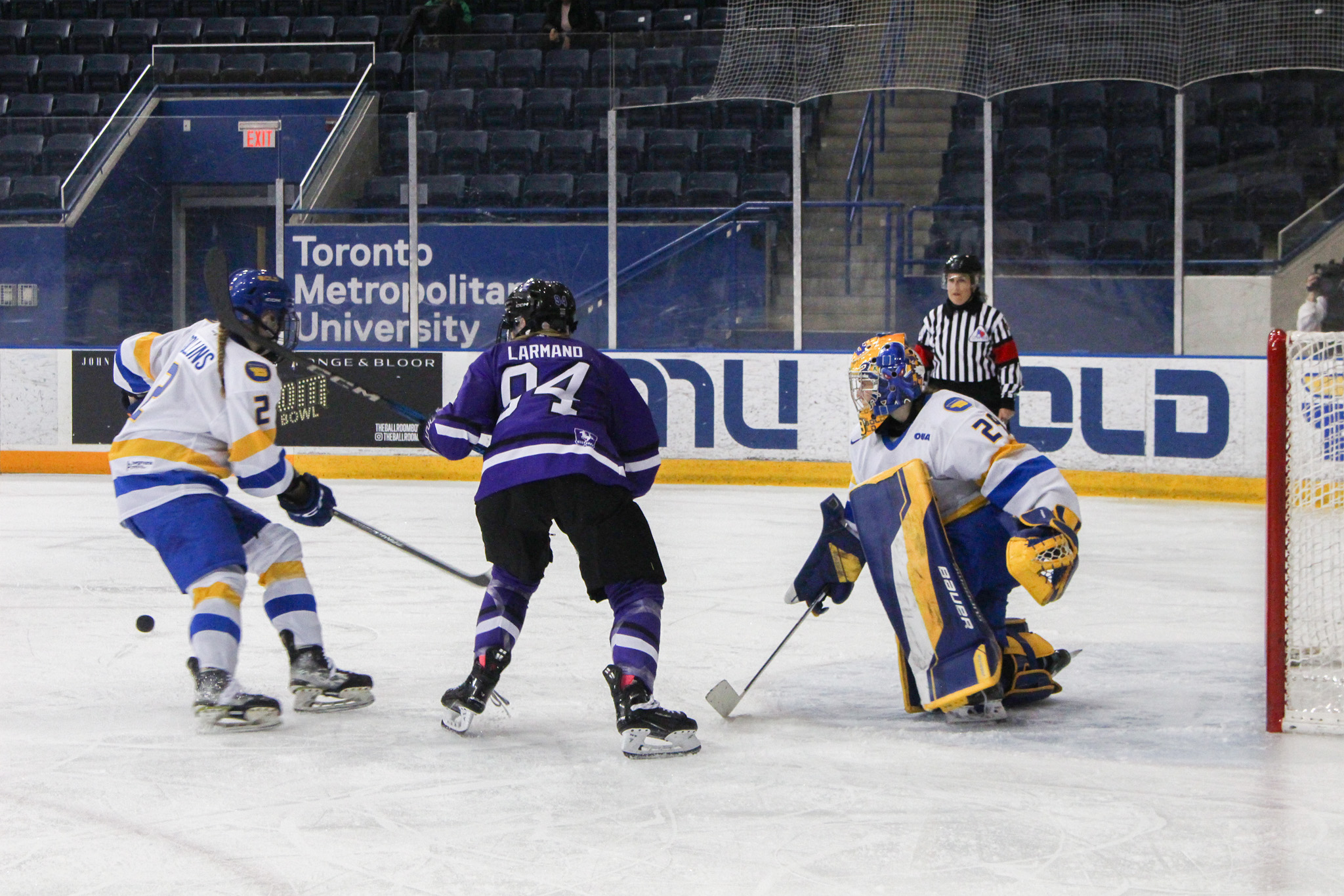 Western tries to get the puck near TMU's crease
