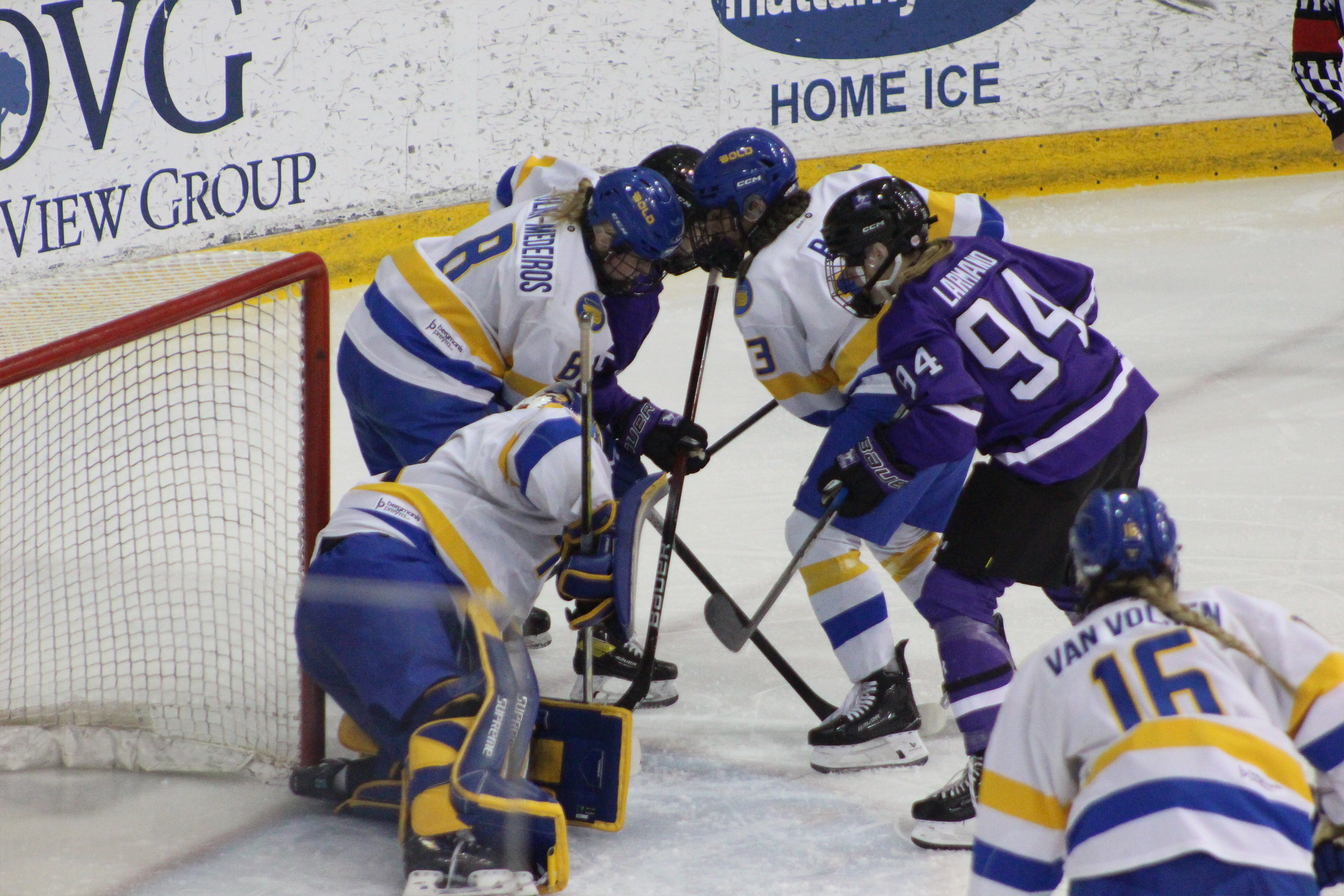 TMU and Western battle for possession at TMU's net